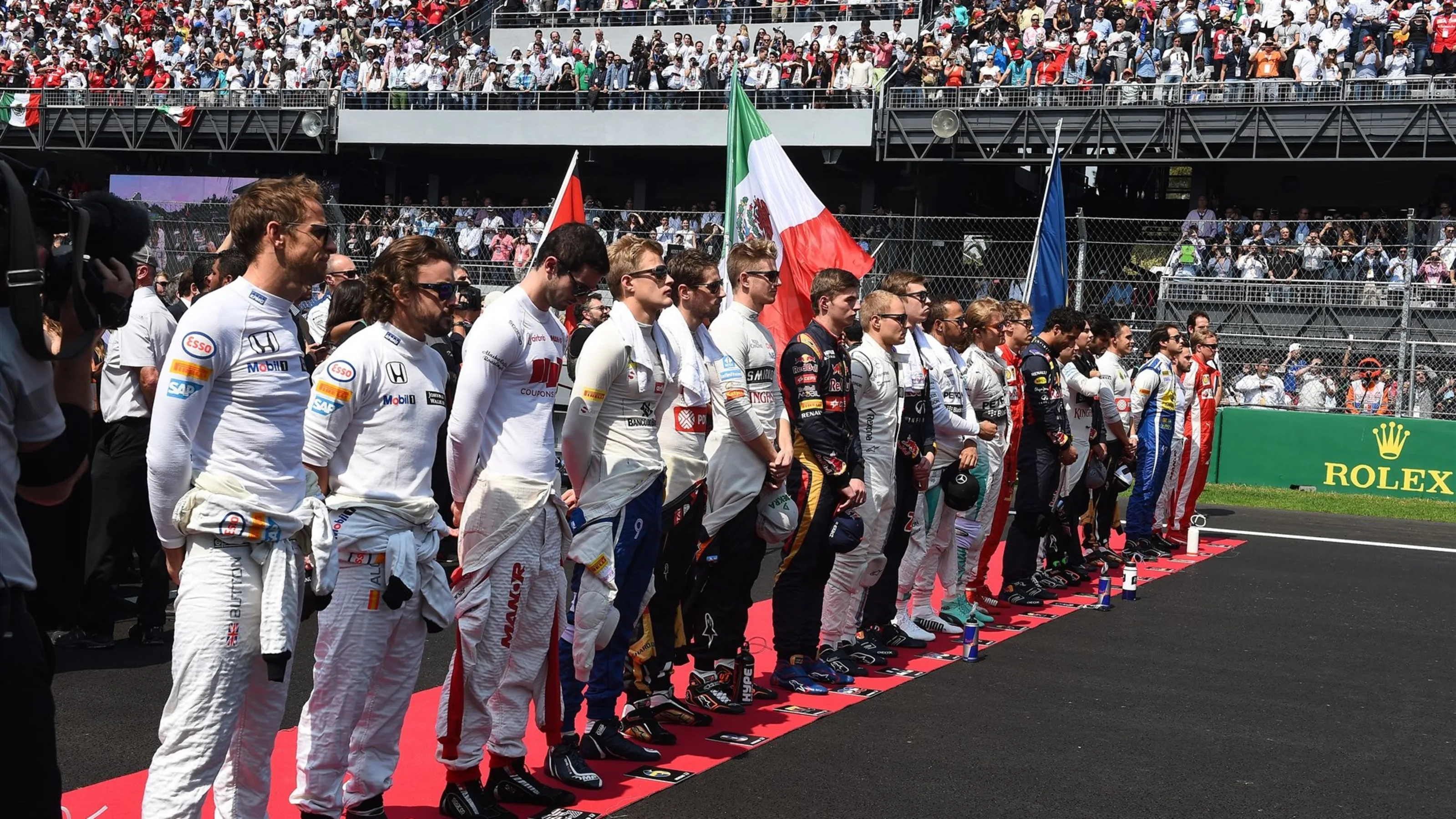 Drivers observe the National Anthem on the grid at Formula One World Championship, Rd17, Mexican