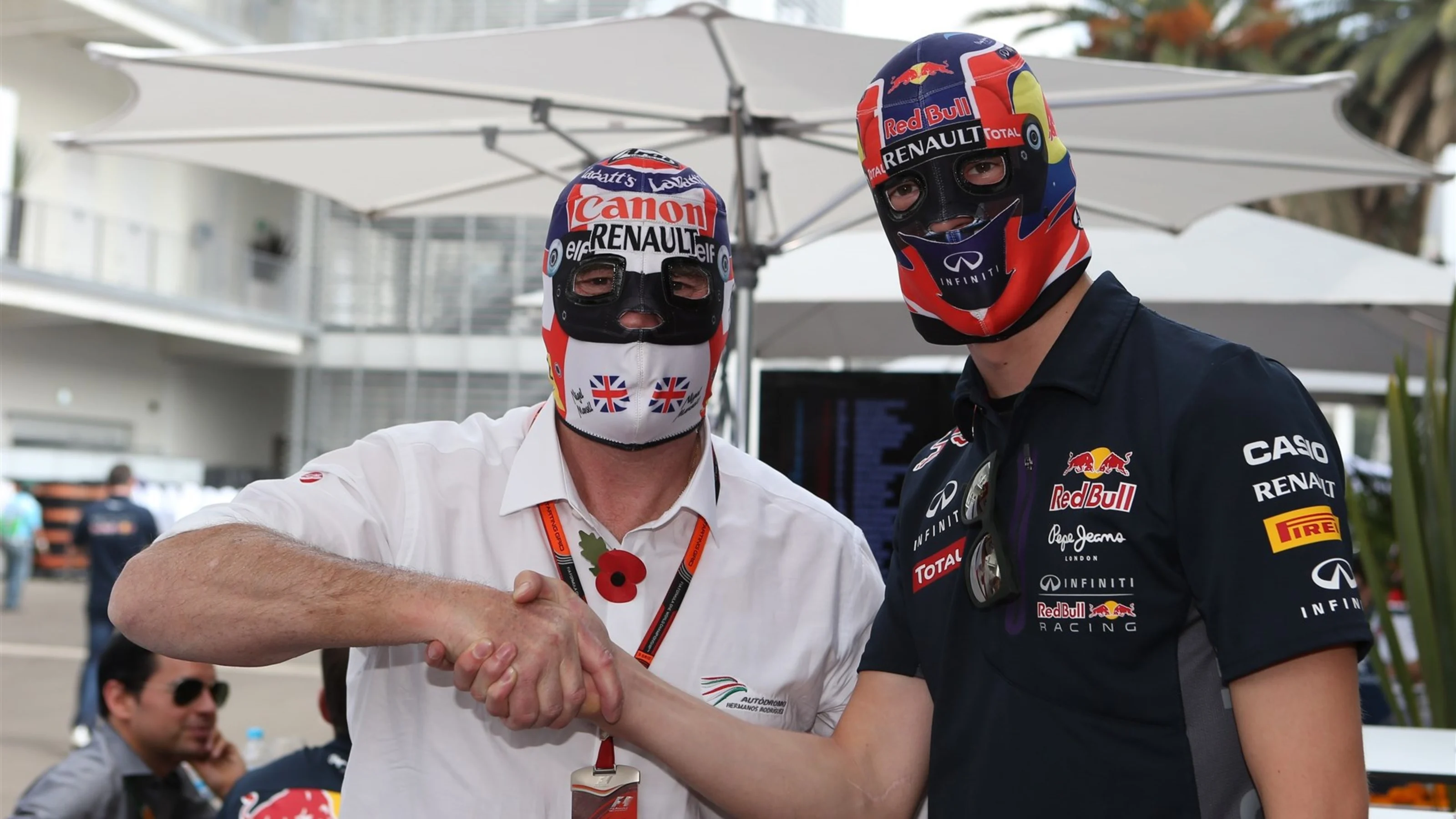 Nigel Mansell (GBR) and Daniil Kyvat (RUS) Red Bull Racing in Lucha Libre masks at Formula One