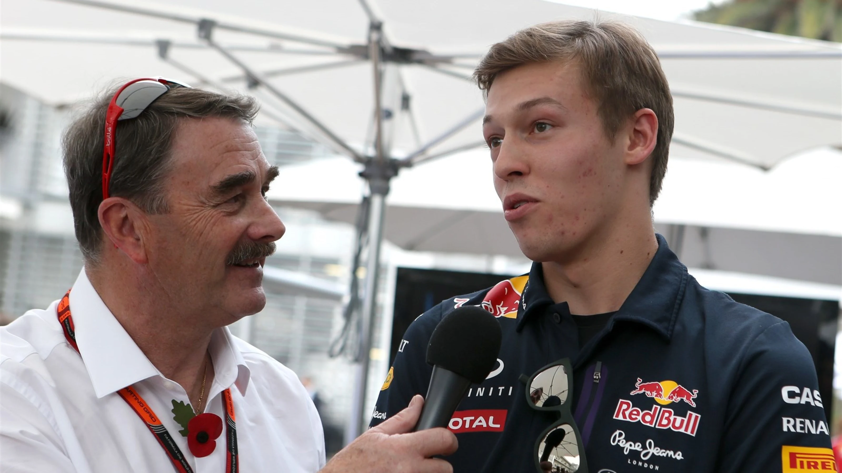 Nigel Mansell (GBR) interviews Daniil Kyvat (RUS) Red Bull Racing at Formula One World