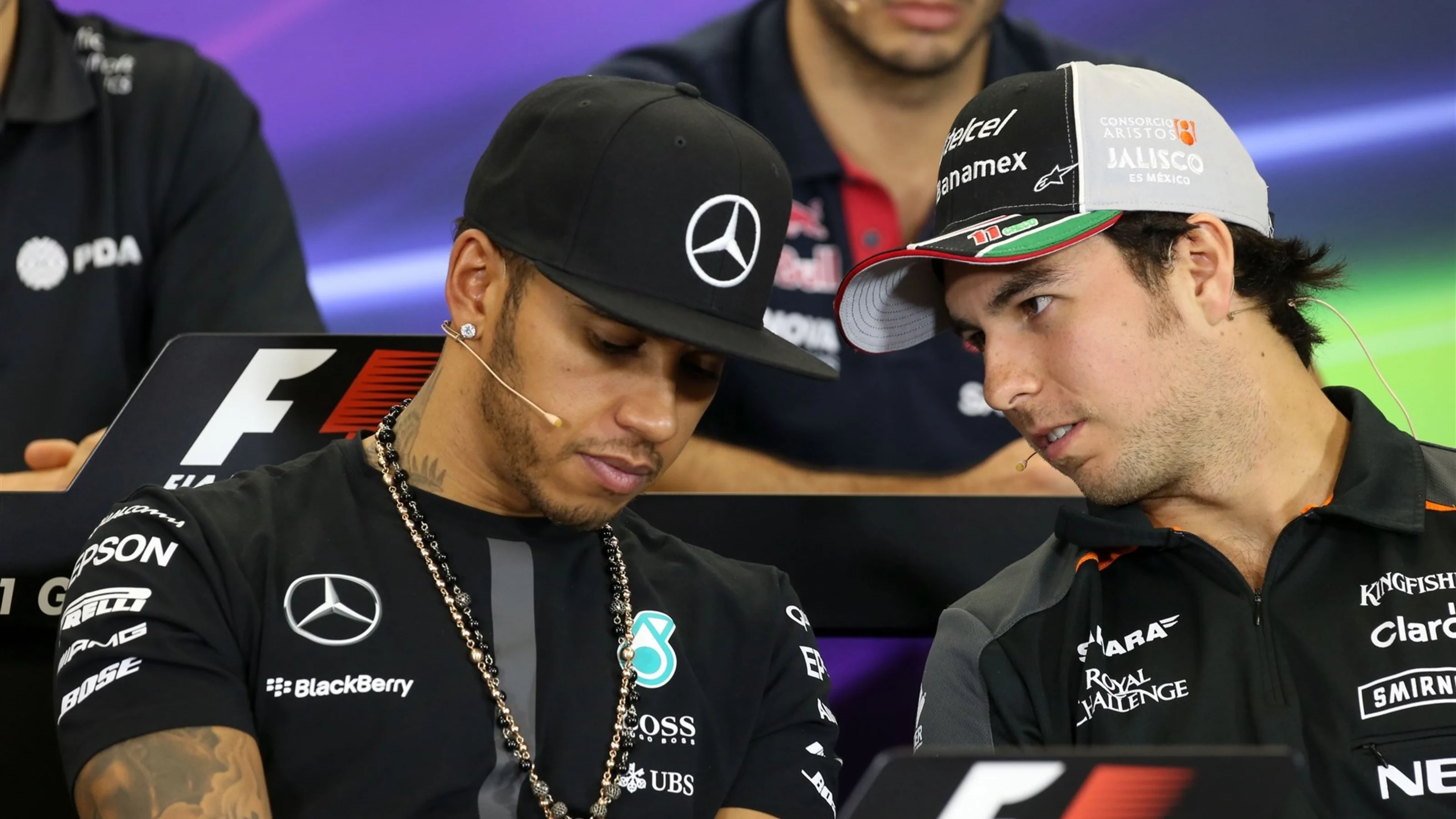 Lewis Hamilton (GBR) Mercedes AMG F1 and Sergio Perez (MEX) Force India at the press conference at