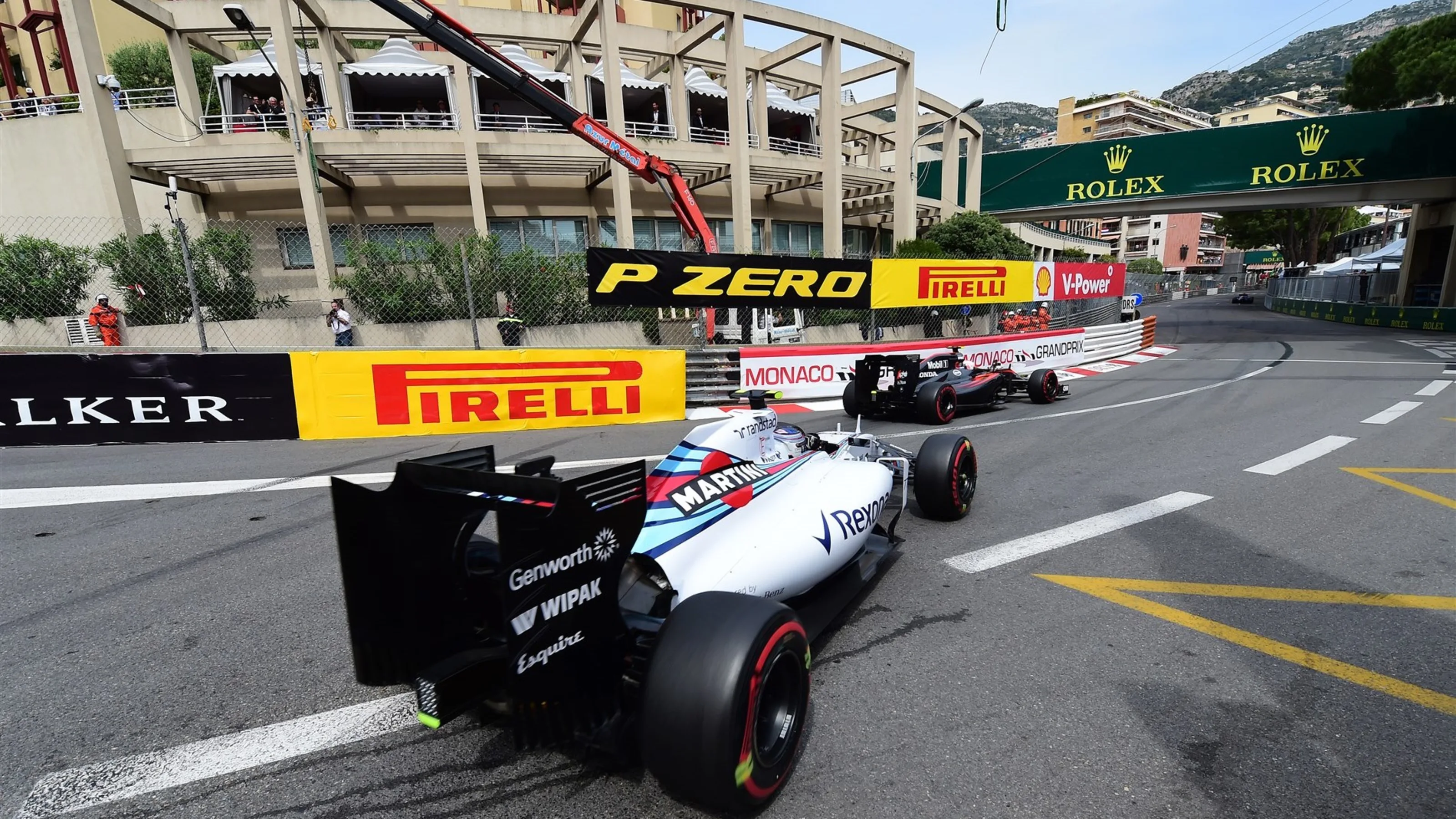 Jenson Button (GBR) McLaren MP4-30 and Valtteri Bottas (FIN) Williams FW37  at Formula One World