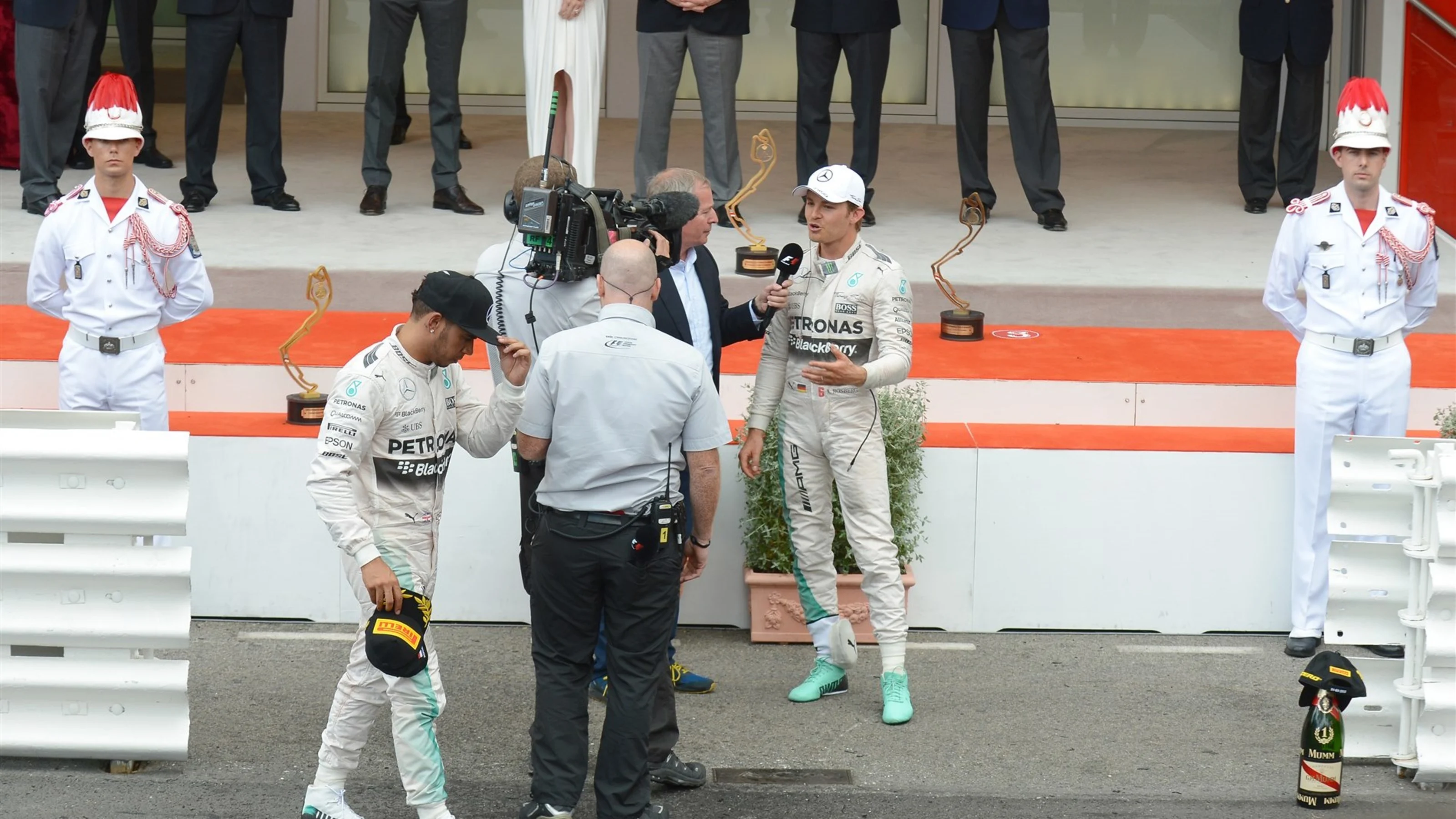 Lewis Hamilton (GBR) Mercedes AMG F1 after the podium as Nico Rosberg (GER) Mercedes AMG F1 talks