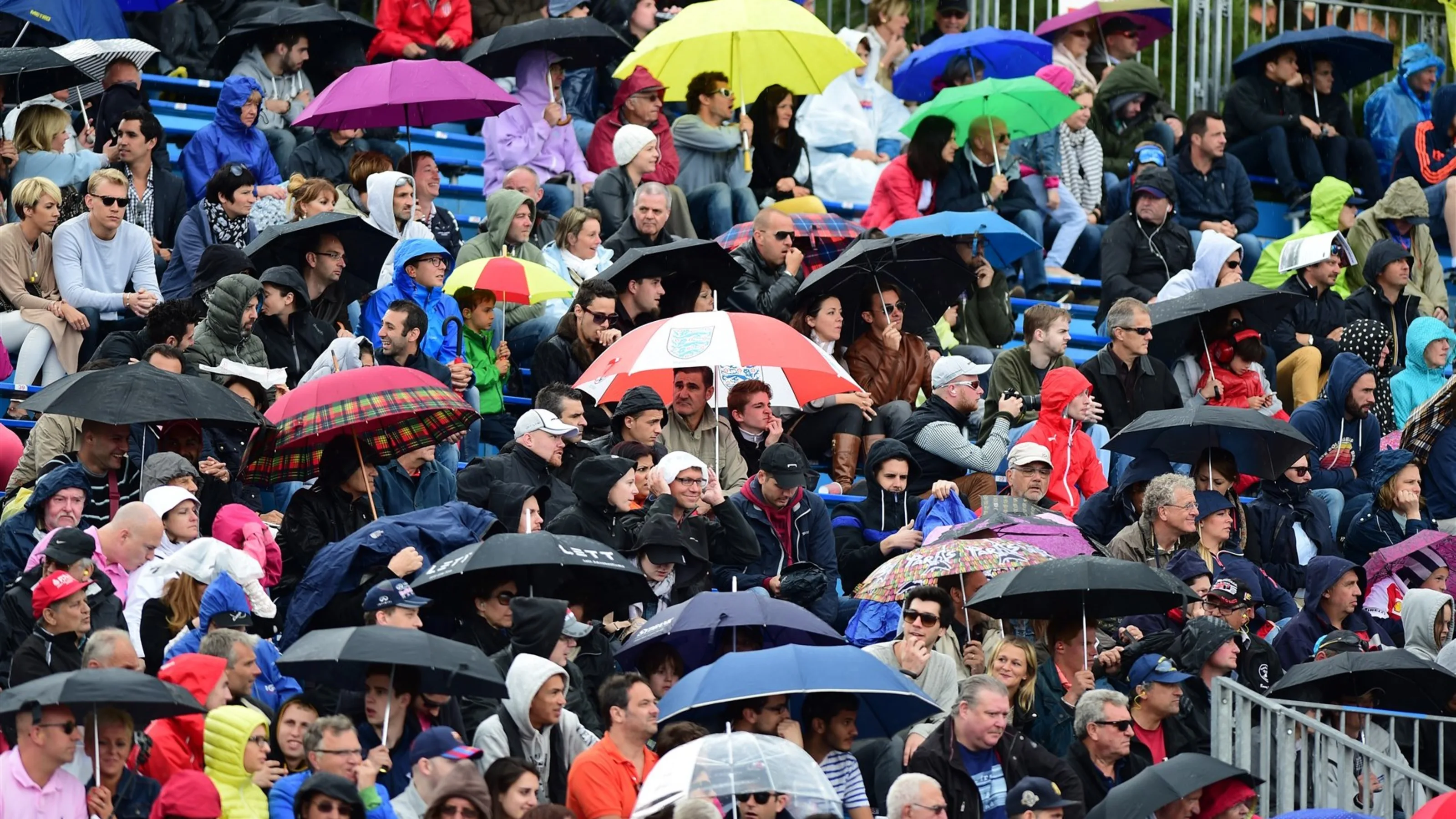 Fans and umbrellas at Formula One World Championship, Rd6, Monaco Grand Prix Practice, Monte-Carlo,
