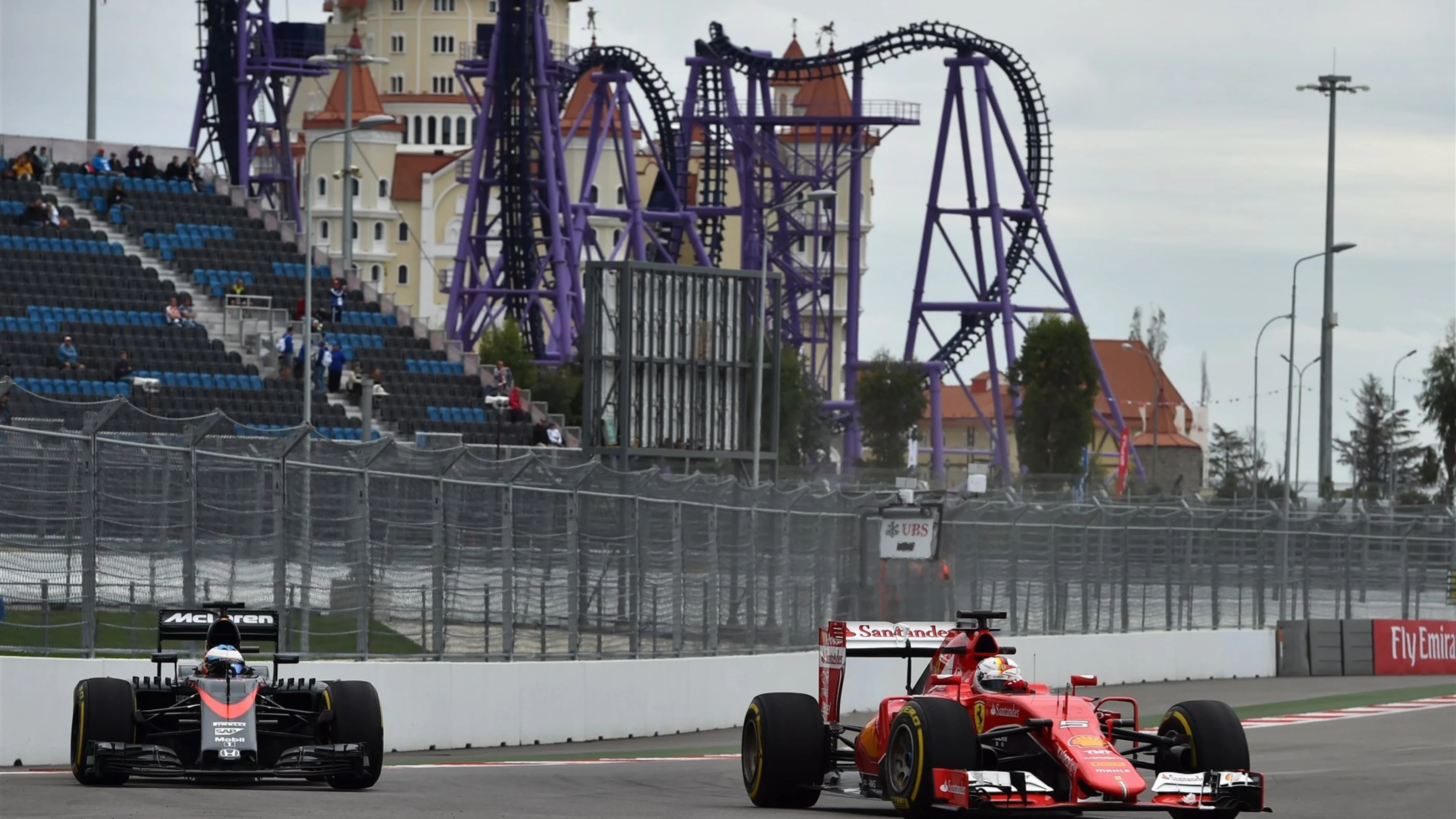 Fernando Alonso (ESP) McLaren MP4-30 and Sebastian Vettel (GER) Ferrari SF15-T at Formula One World