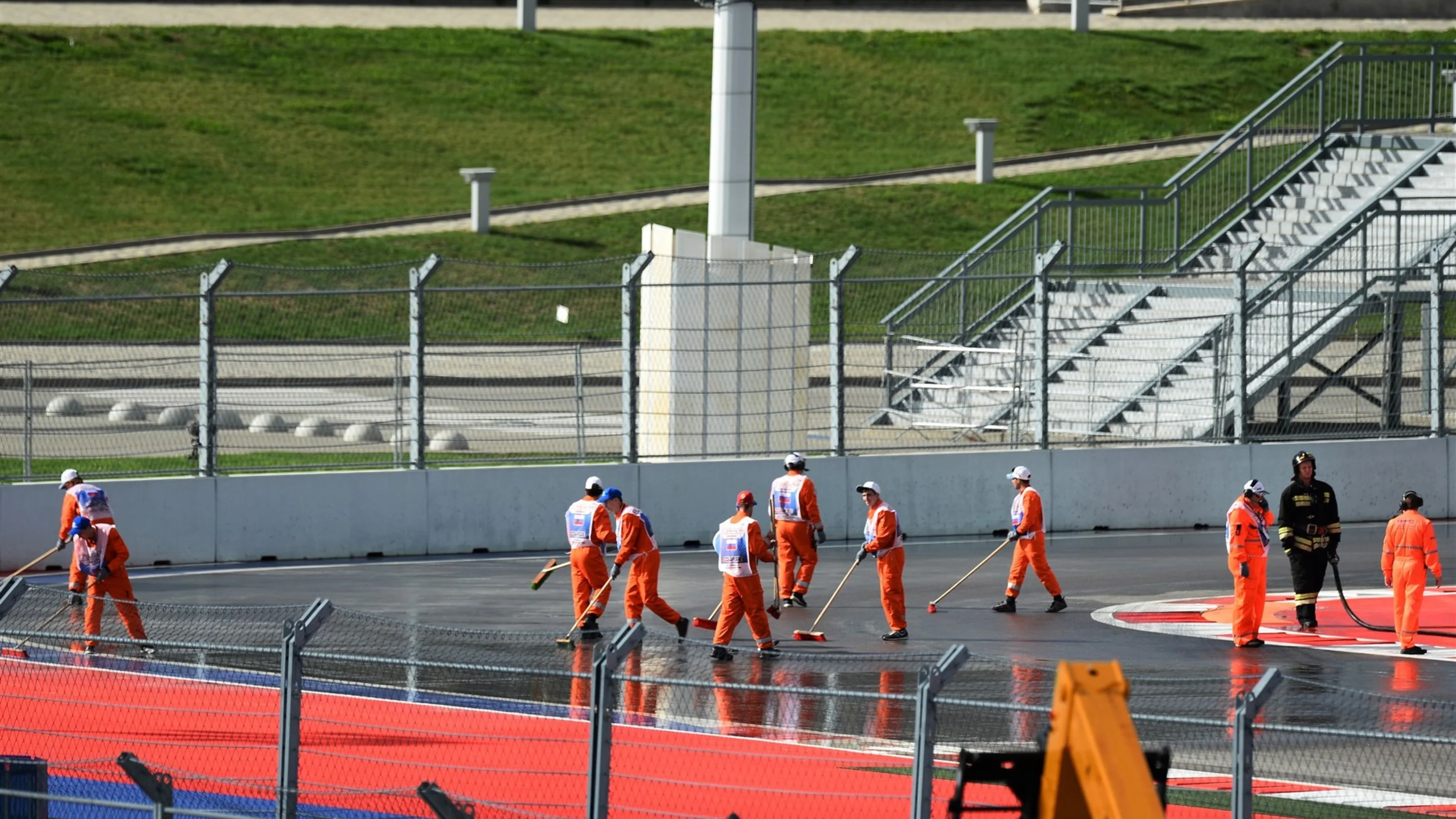 Marshals clean the track before FP1 at Formula One World Championship, Rd15, Russian Grand Prix,