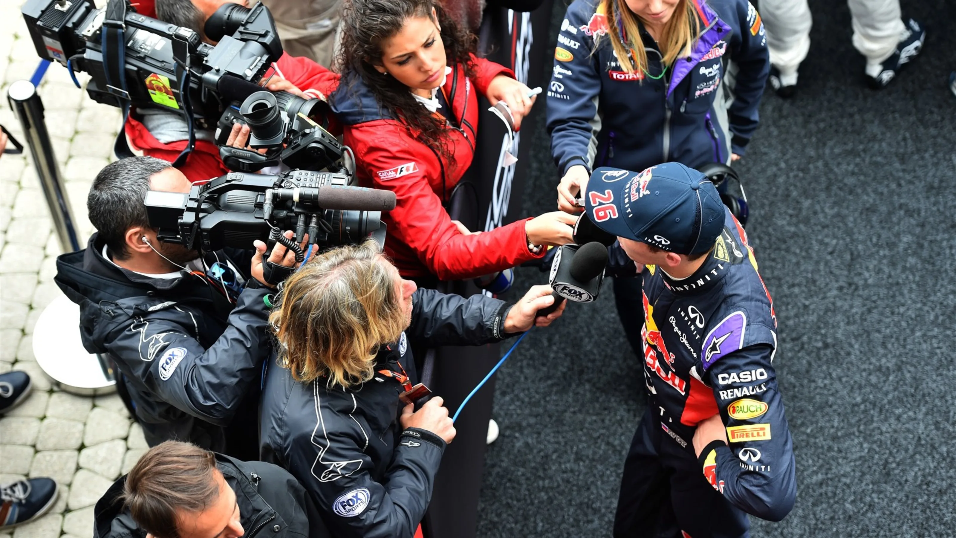 Daniil Kvyat (RUS) Red Bull Racing talks with the medua at Formula One World Championship, Rd15,