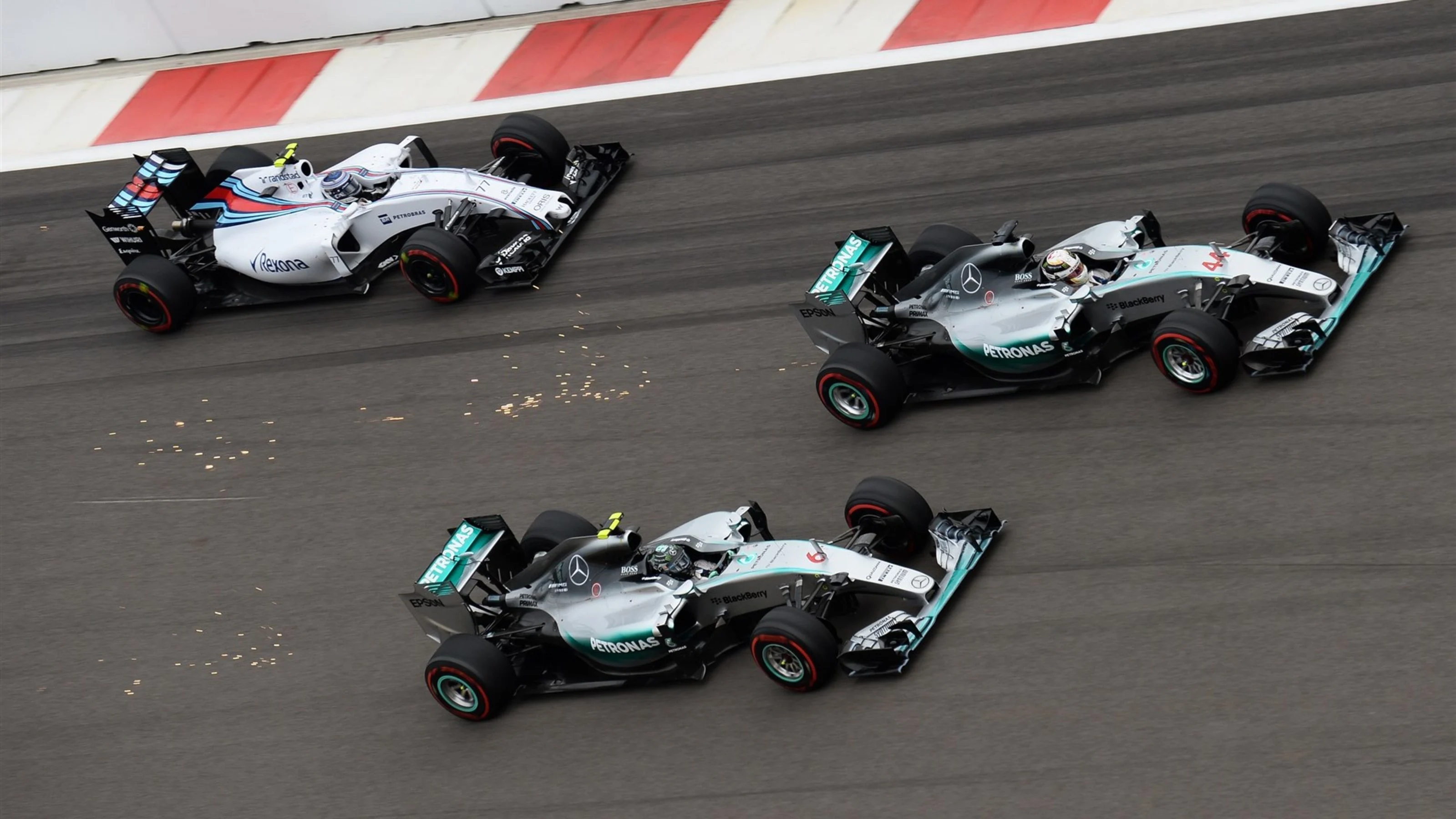 Lewis Hamilton (GBR) Mercedes AMG F1 W06 and Nico Rosberg (GER) Mercedes AMG F1 W06 battle for