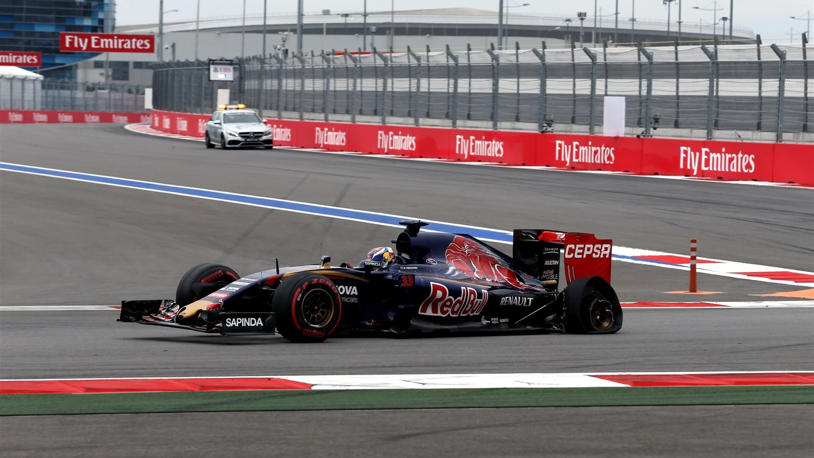Max Verstappen (NDL) Scuderia Toro Rosso STR10 with rear puncture on lap one at Formula One World