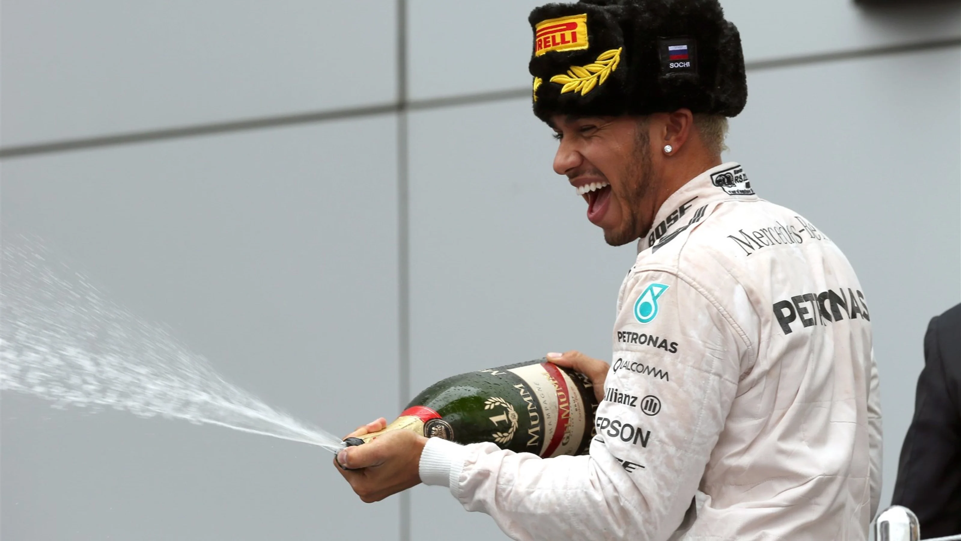 Race winner Lewis Hamilton (GBR) Mercedes AMG F1 celebrates on the podium with champagne at Formula