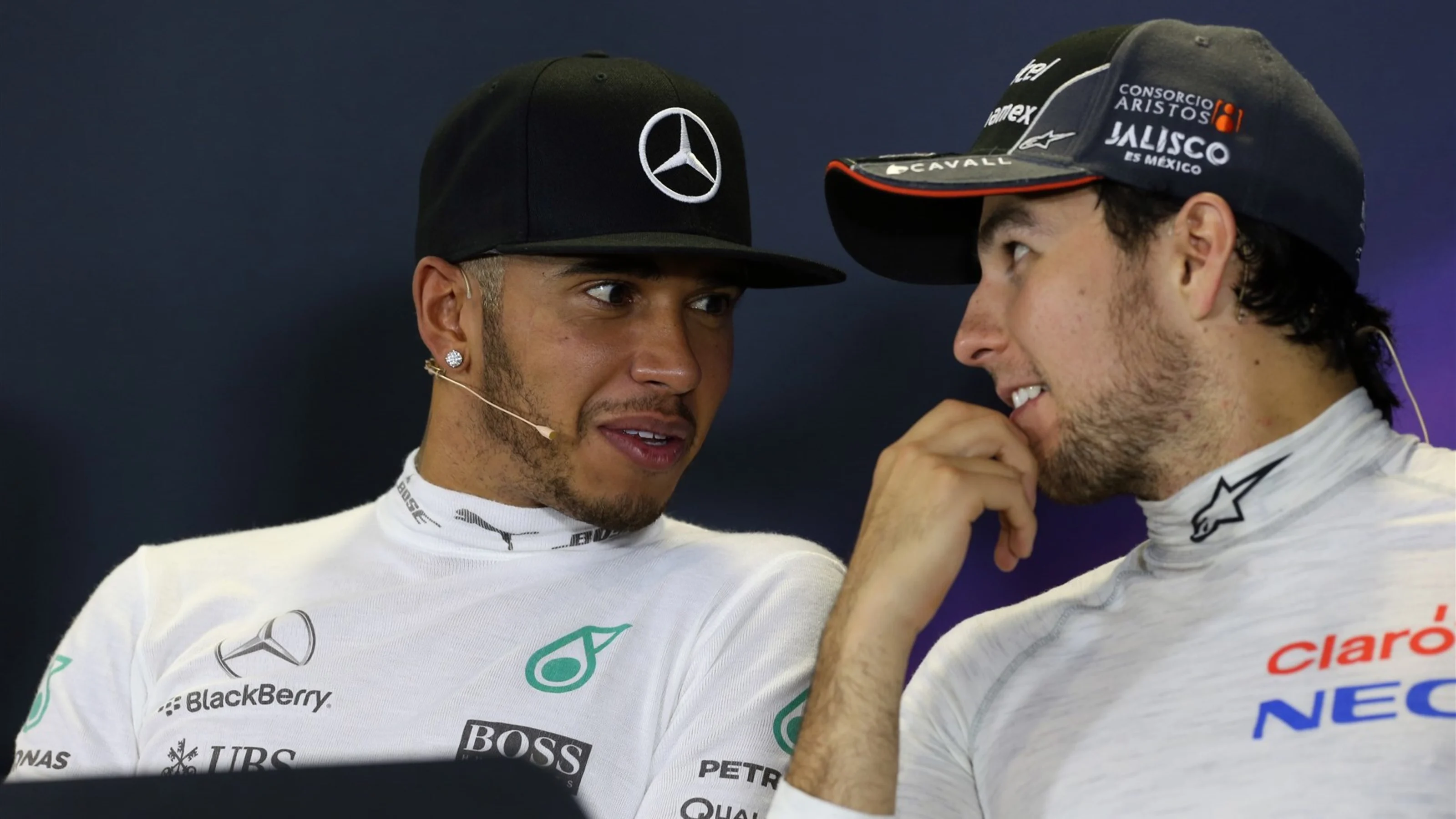 Lewis Hamilton (GBR) Mercedes AMG F1 and Sergio Perez (MEX) Force India in the Press Conference at