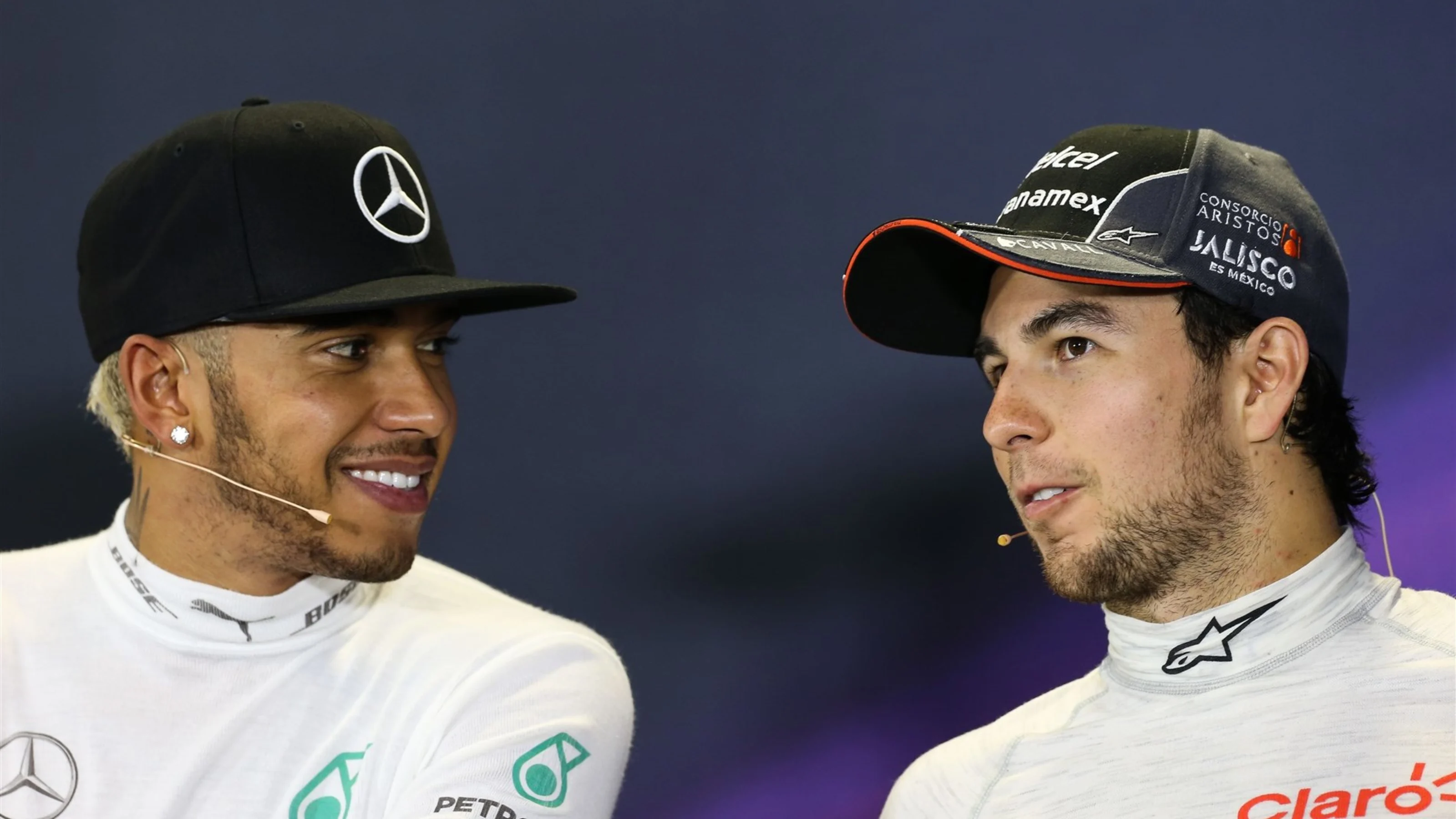 Lewis Hamilton (GBR) Mercedes AMG F1 and Sergio Perez (MEX) Force India in the Press Conference at