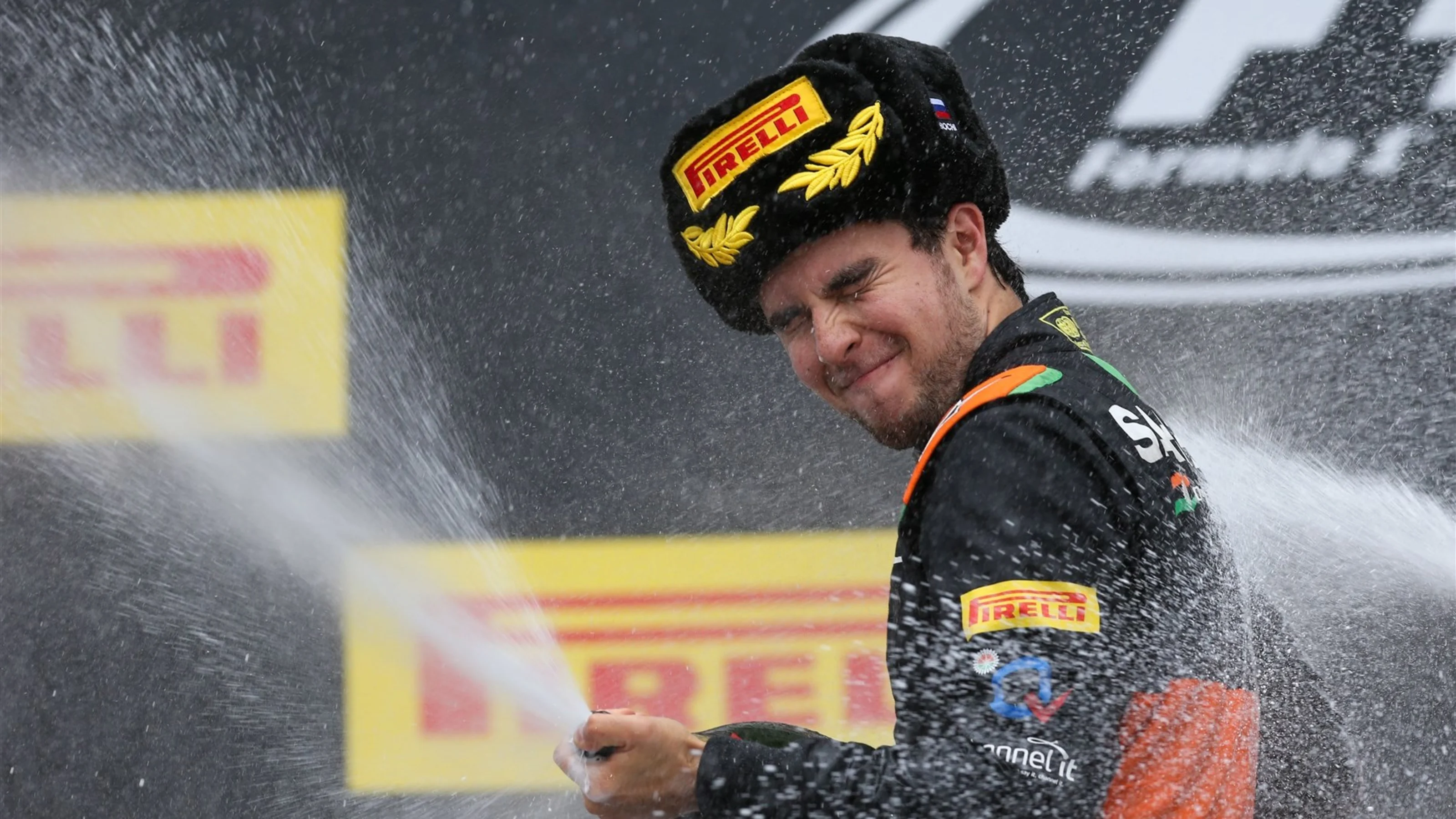 Sergio Perez (MEX) Force India celebrates with champagne on the podium at Formula One World