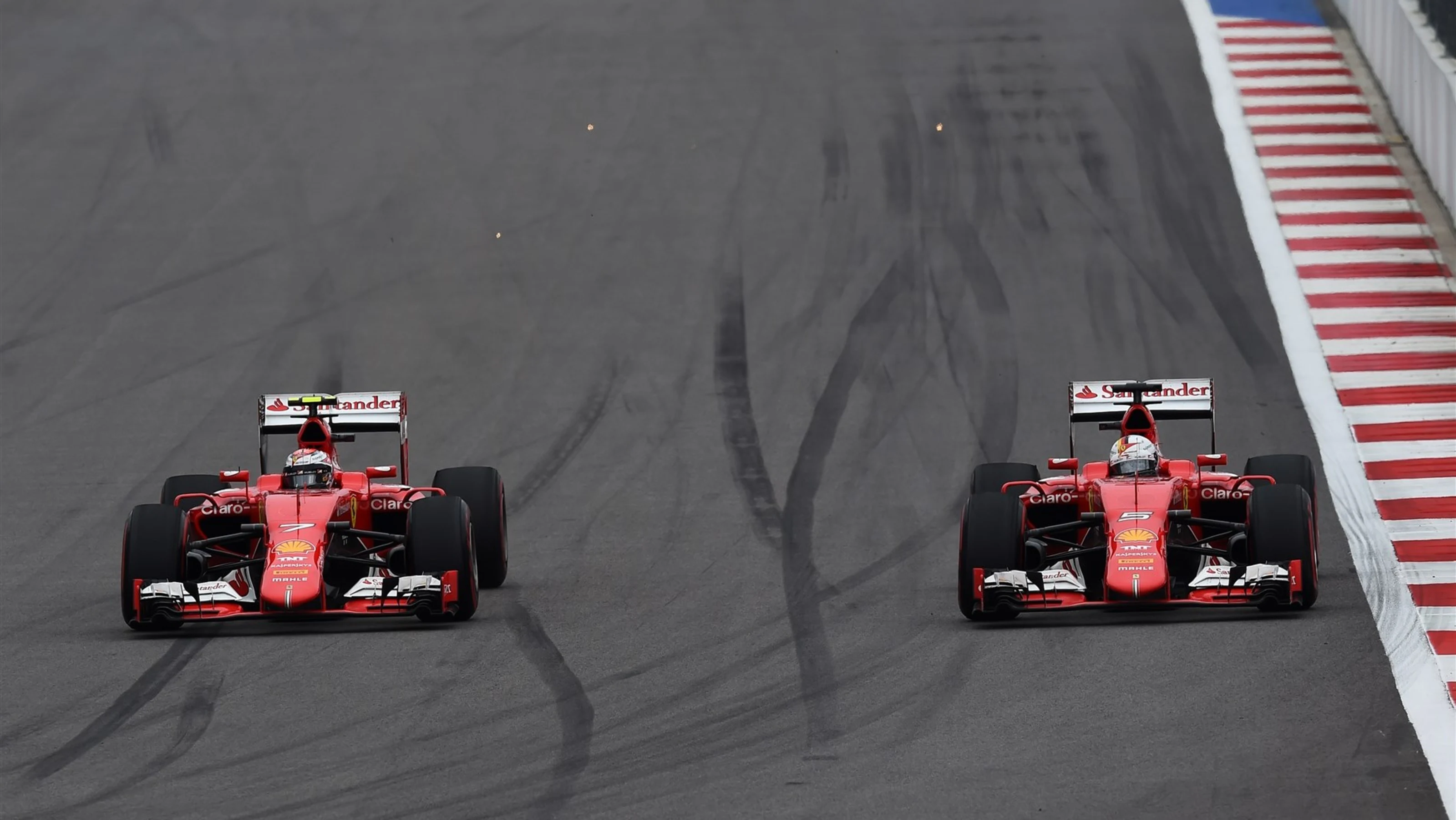 Kimi Raikkonen (FIN) Ferrari SF15-T and Sebastian Vettel (GER) Ferrari SF15-T battle at Formula One