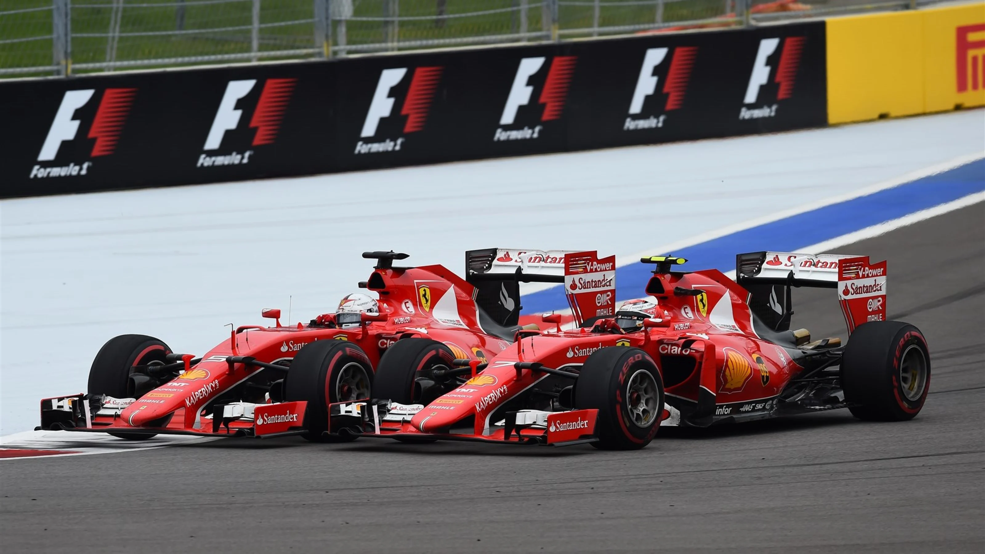 Sebastian Vettel (GER) Ferrari SF15-T and Kimi Raikkonen (FIN) Ferrari SF15-T battle at Formula One