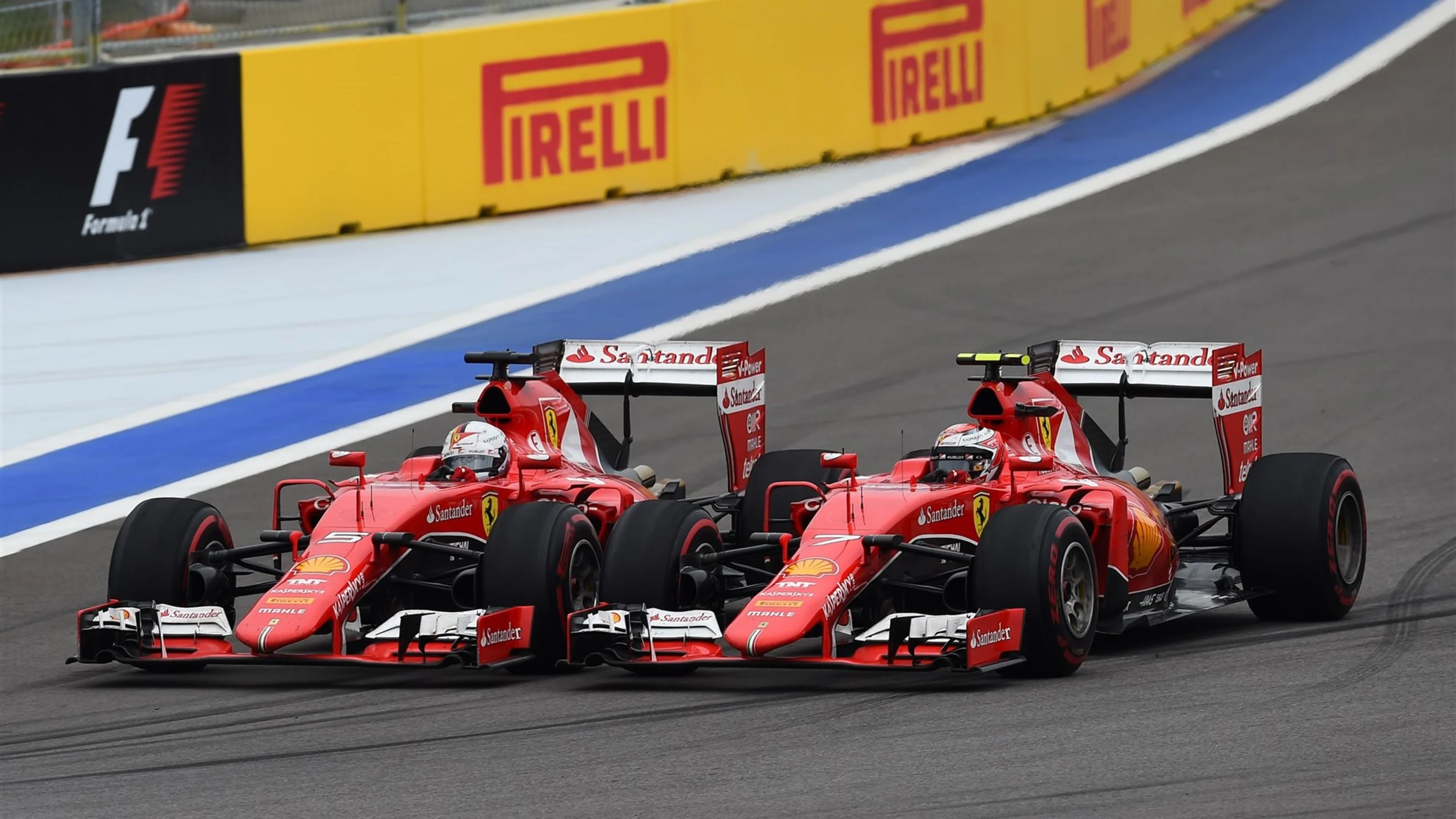 Sebastian Vettel (GER) Ferrari SF15-T and Kimi Raikkonen (FIN) Ferrari SF15-T battle at Formula One