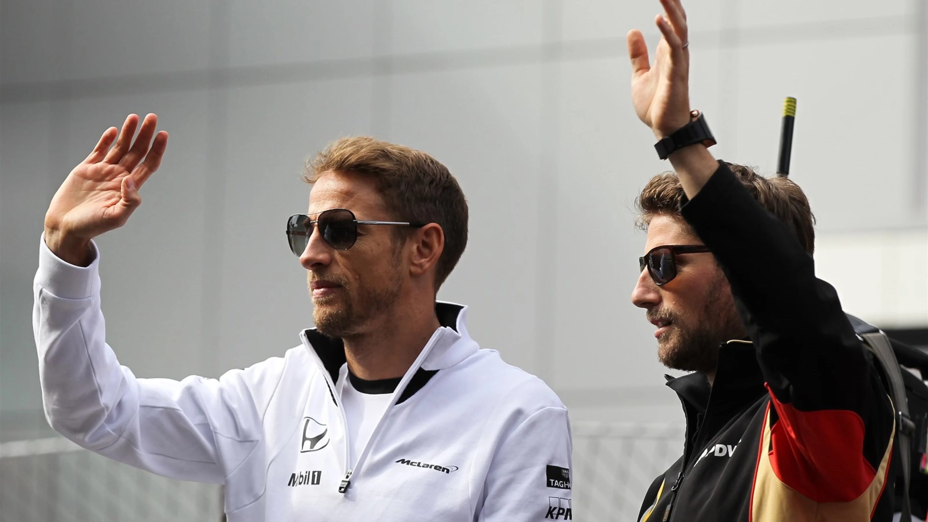 Jenson Button (GBR) McLaren and Romain Grosjean (FRA) Lotus F1 at the drivers parade at Formula One