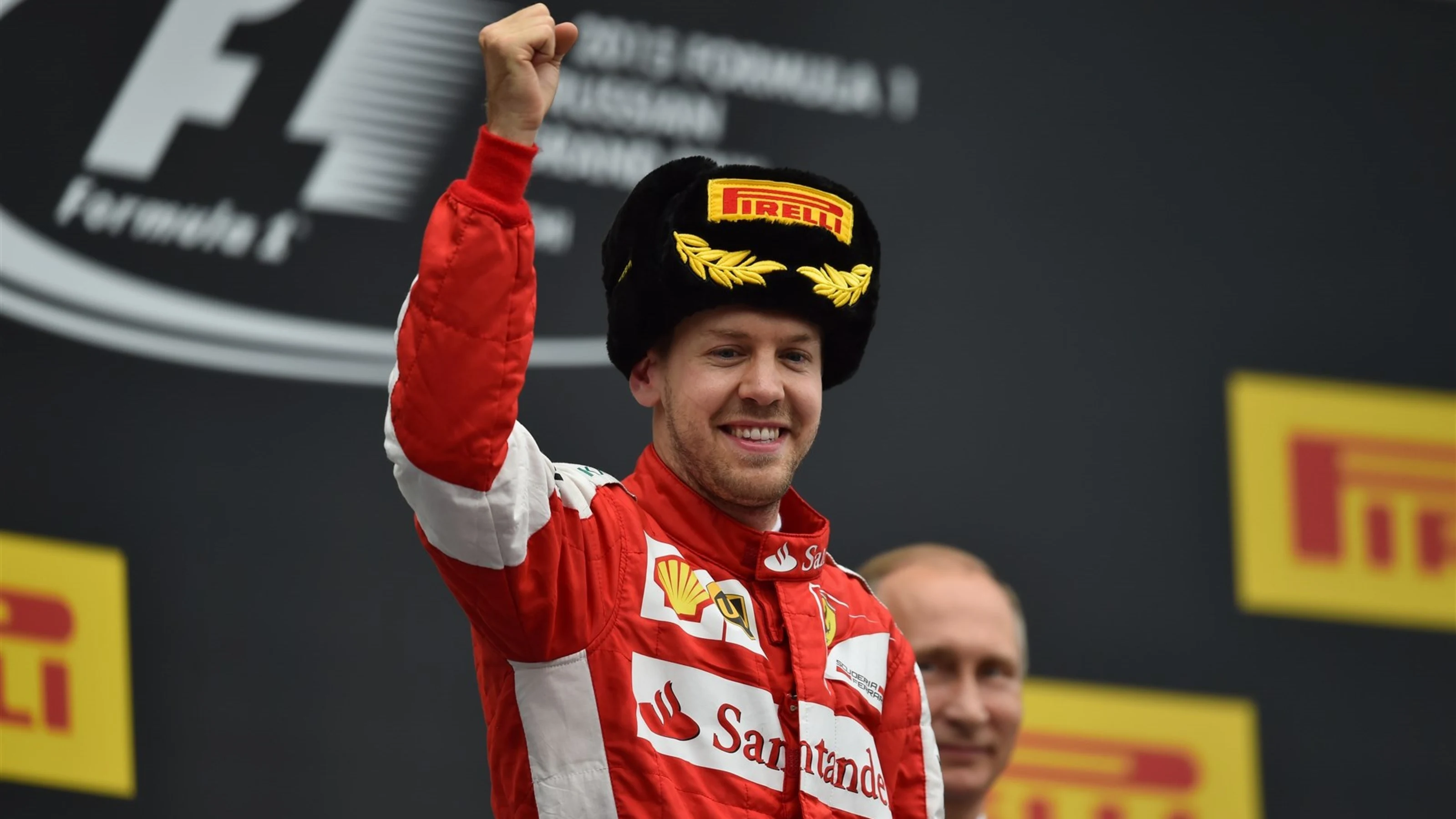 Sebastian Vettel (GER) Ferrari celebrates on the podium at Formula One World Championship, Rd15,