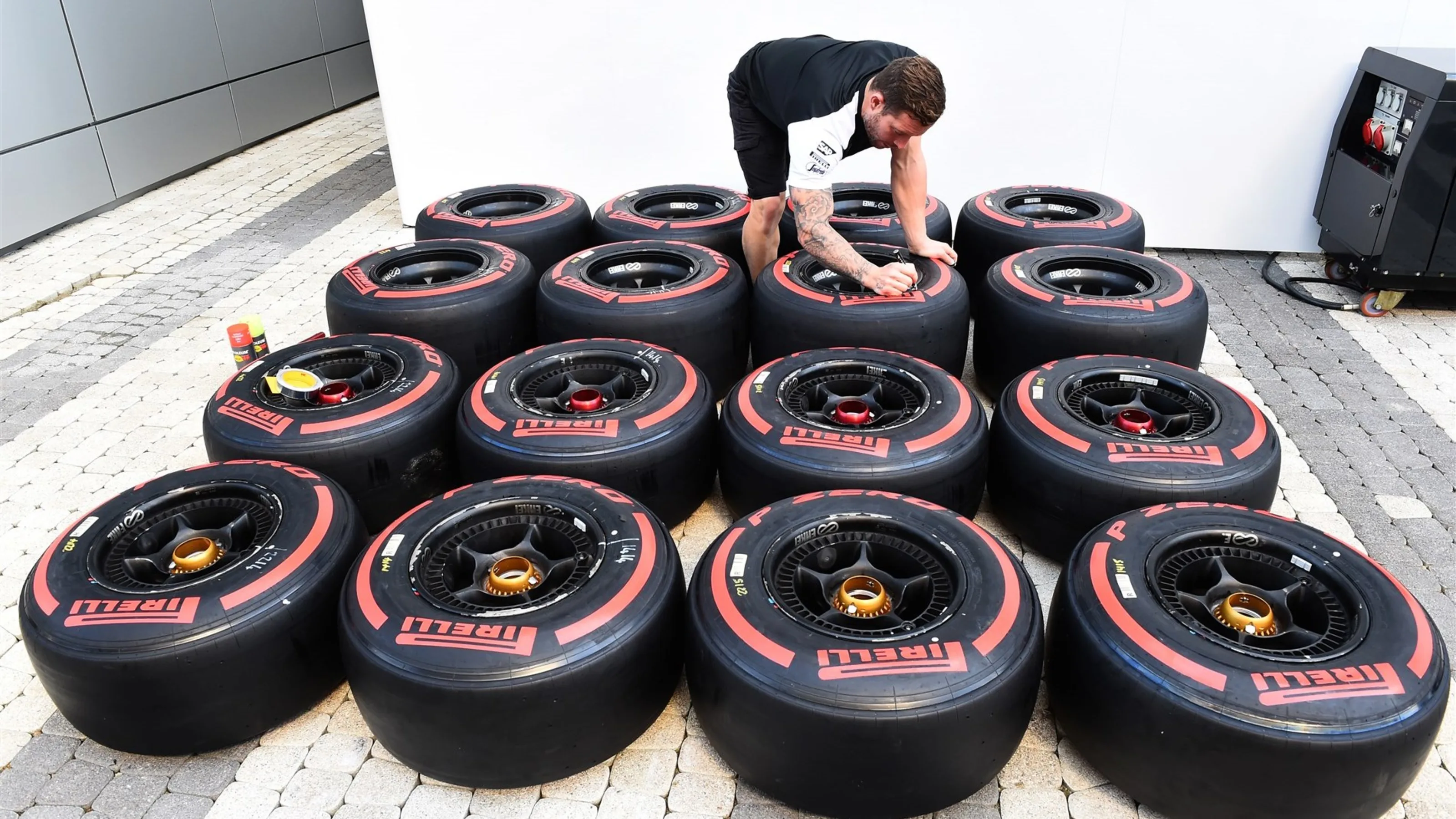 McLaren mechanic and Pirelli tyres at Formula One World Championship, Rd15, Russian Grand Prix,