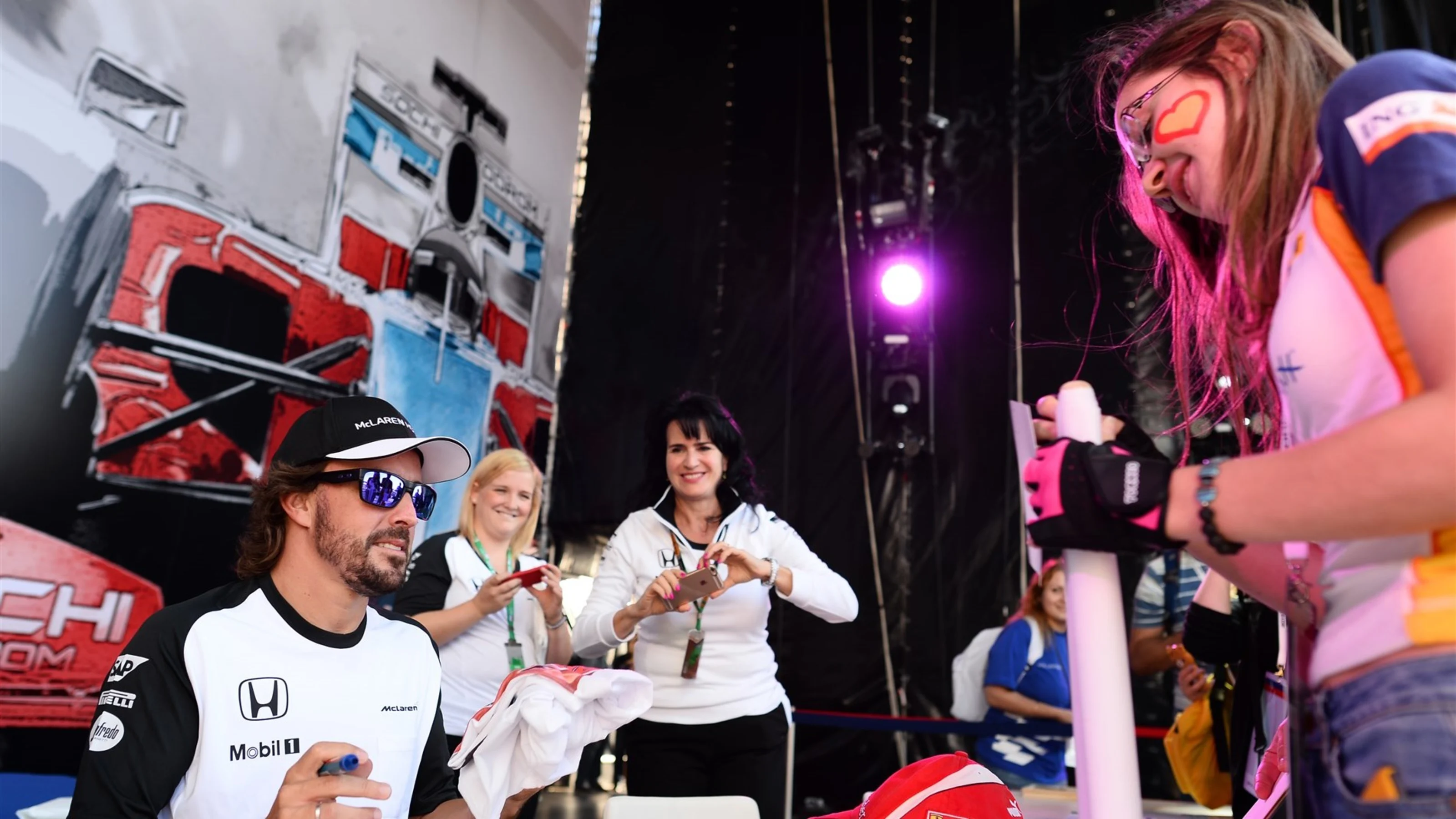 Fernando Alonso (ESP) McLaren signs autographs for the fans at Formula One World Championship,