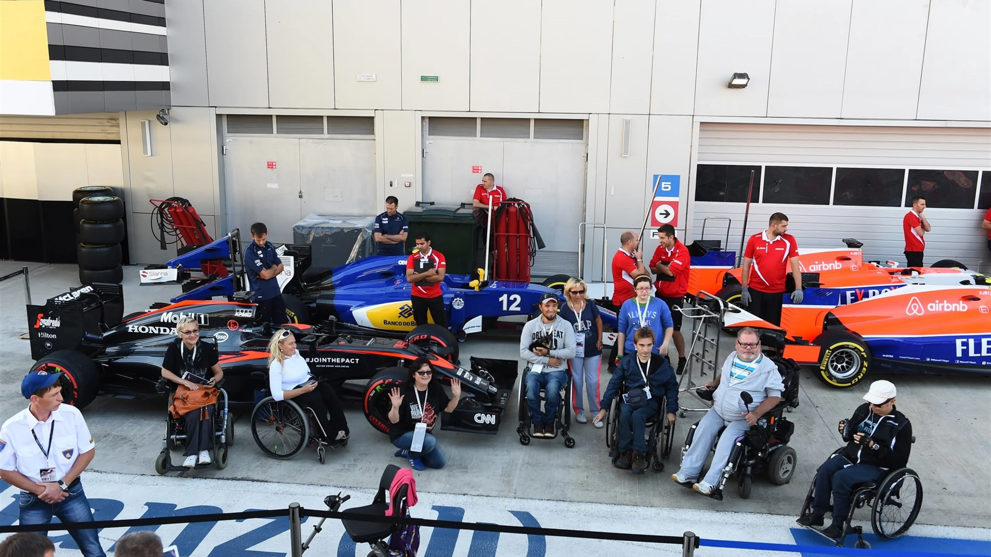 Teams at scrutineering with fans at Formula One World Championship, Rd15, Russian Grand Prix,