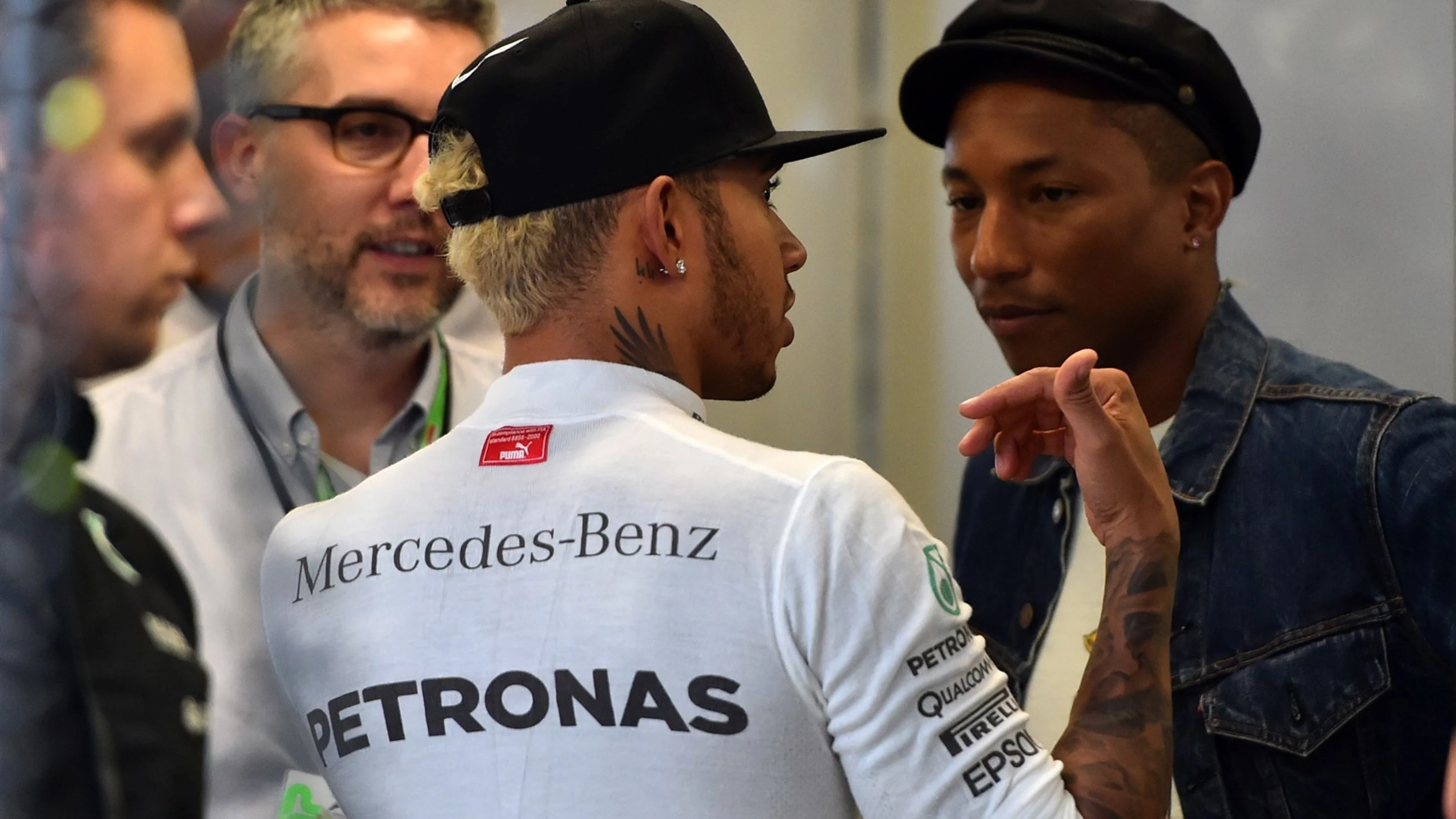 Lewis Hamilton (GBR) Mercedes AMG F1 and Pharrell Williams (USA) in the Mercedes AMG F1 garage at