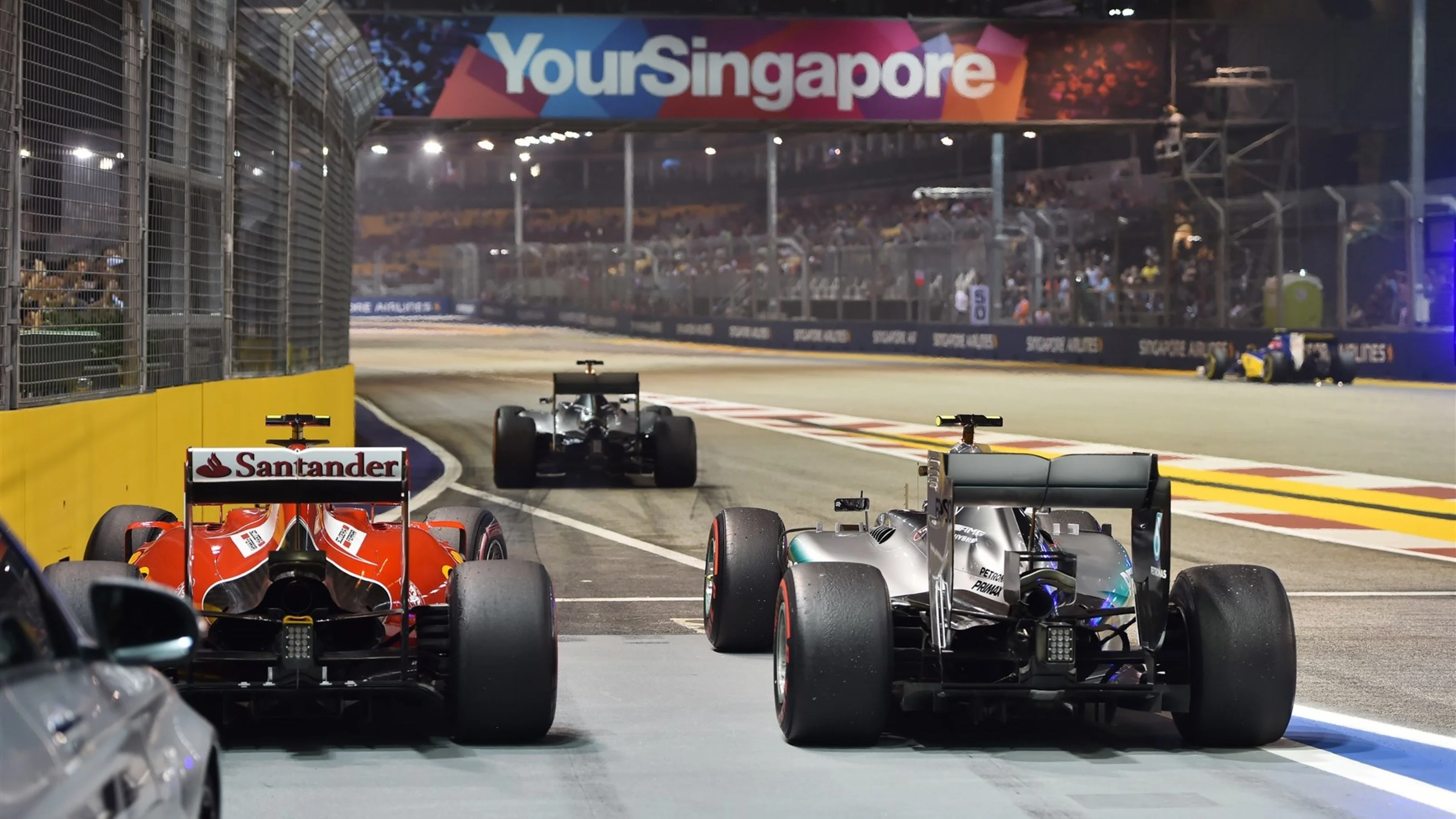 Kimi Raikkonen (FIN) Ferrari SF15-T and Nico Rosberg (GER) Mercedes AMG F1 W06 at Formula One World
