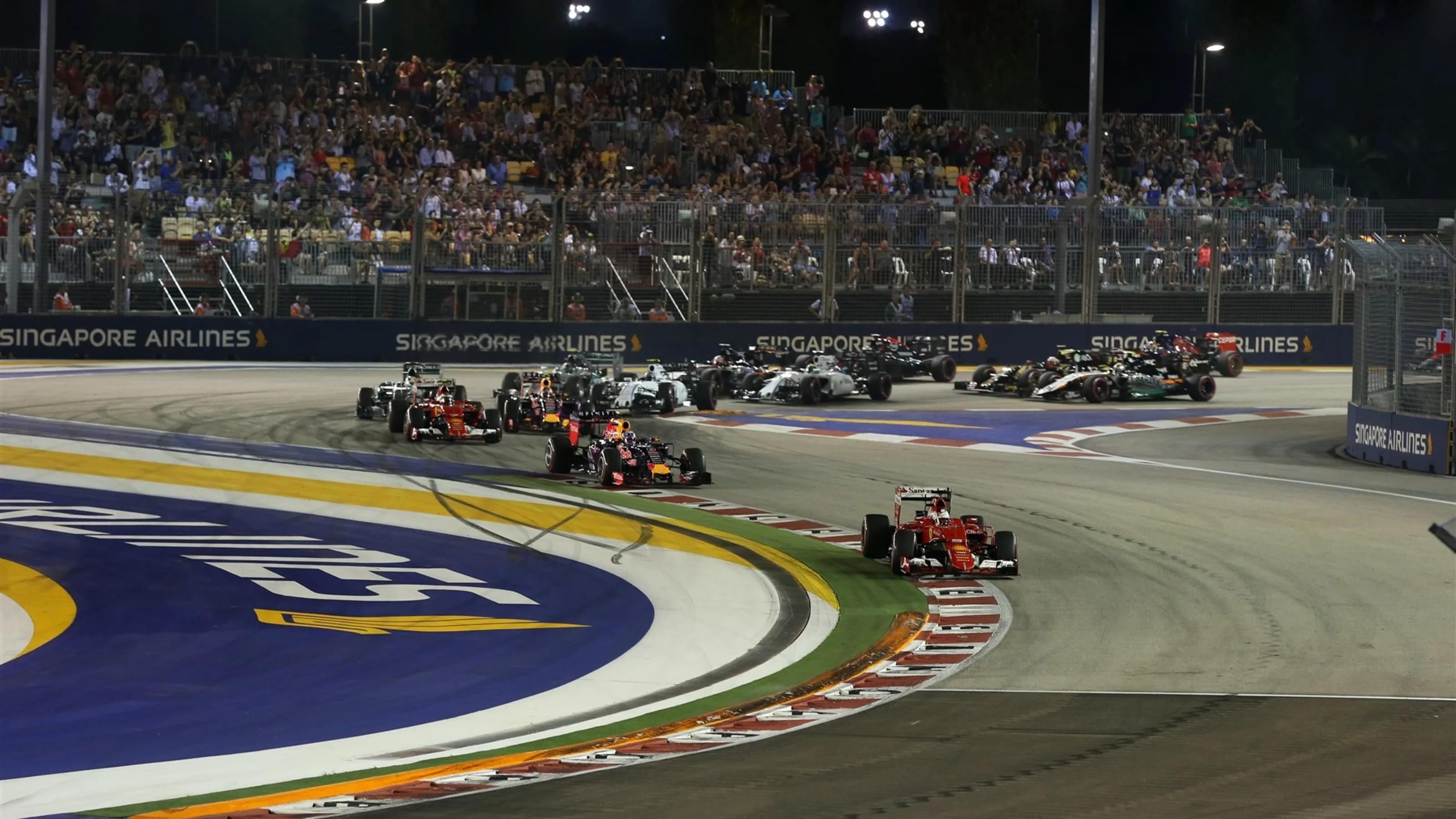 Sebastian Vettel (GER) Ferrari SF15-T leads at the start of the race at Formula One World