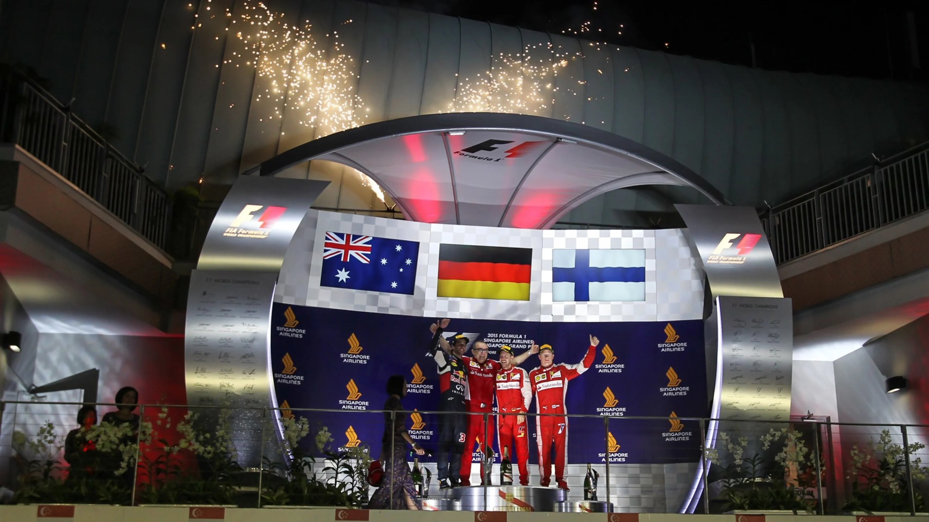 (L to R): Daniel Ricciardo (AUS) Red Bull Racing, Modesta Menabue (ITA) Ferrari Engine Specialist,