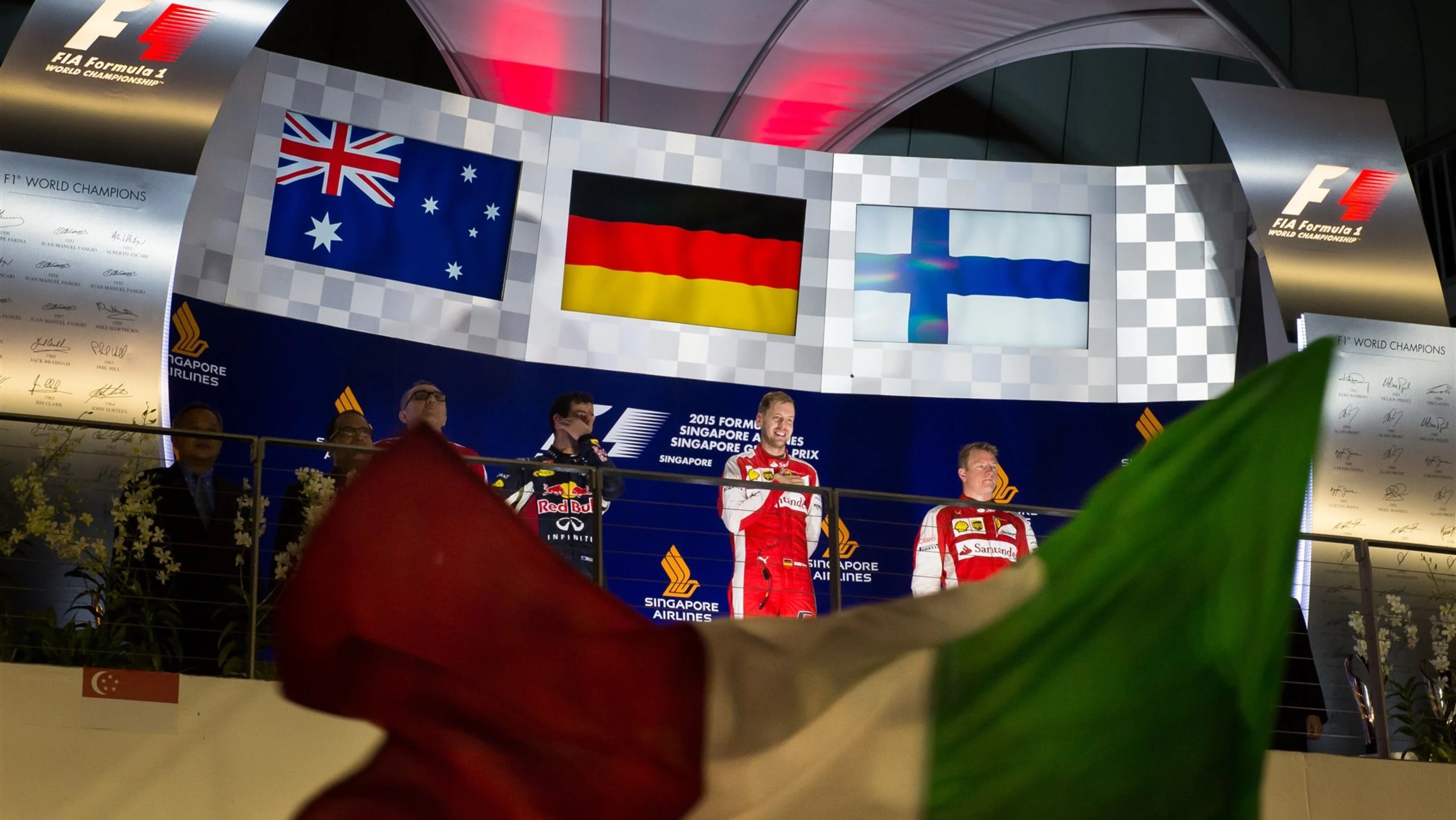 (L to R): Daniel Ricciardo (AUS) Red Bull Racing, Modesta Menabue (ITA) Ferrari Engine Specialist,