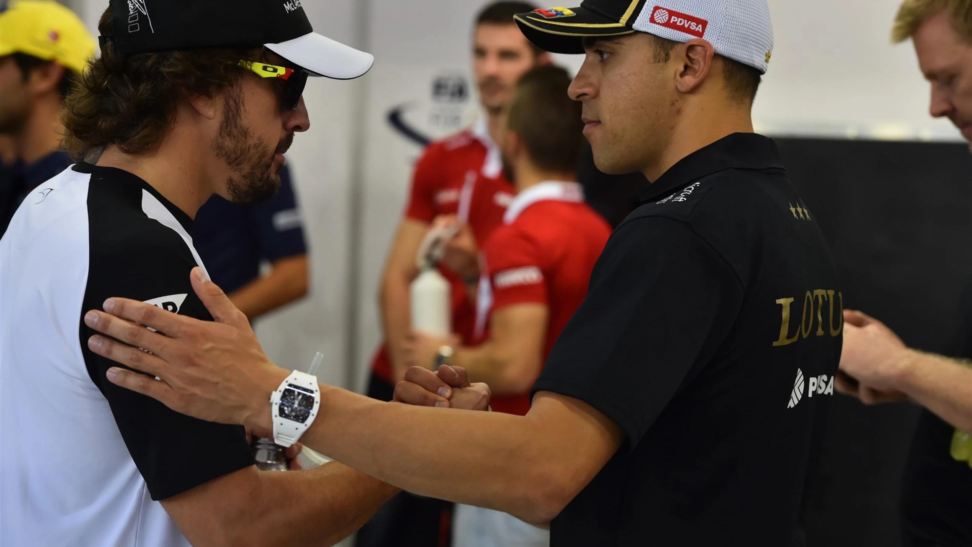 Fernando Alonso (ESP) McLaren and Pastor Maldonado (VEN) Lotus on the drivers parade at Formula One