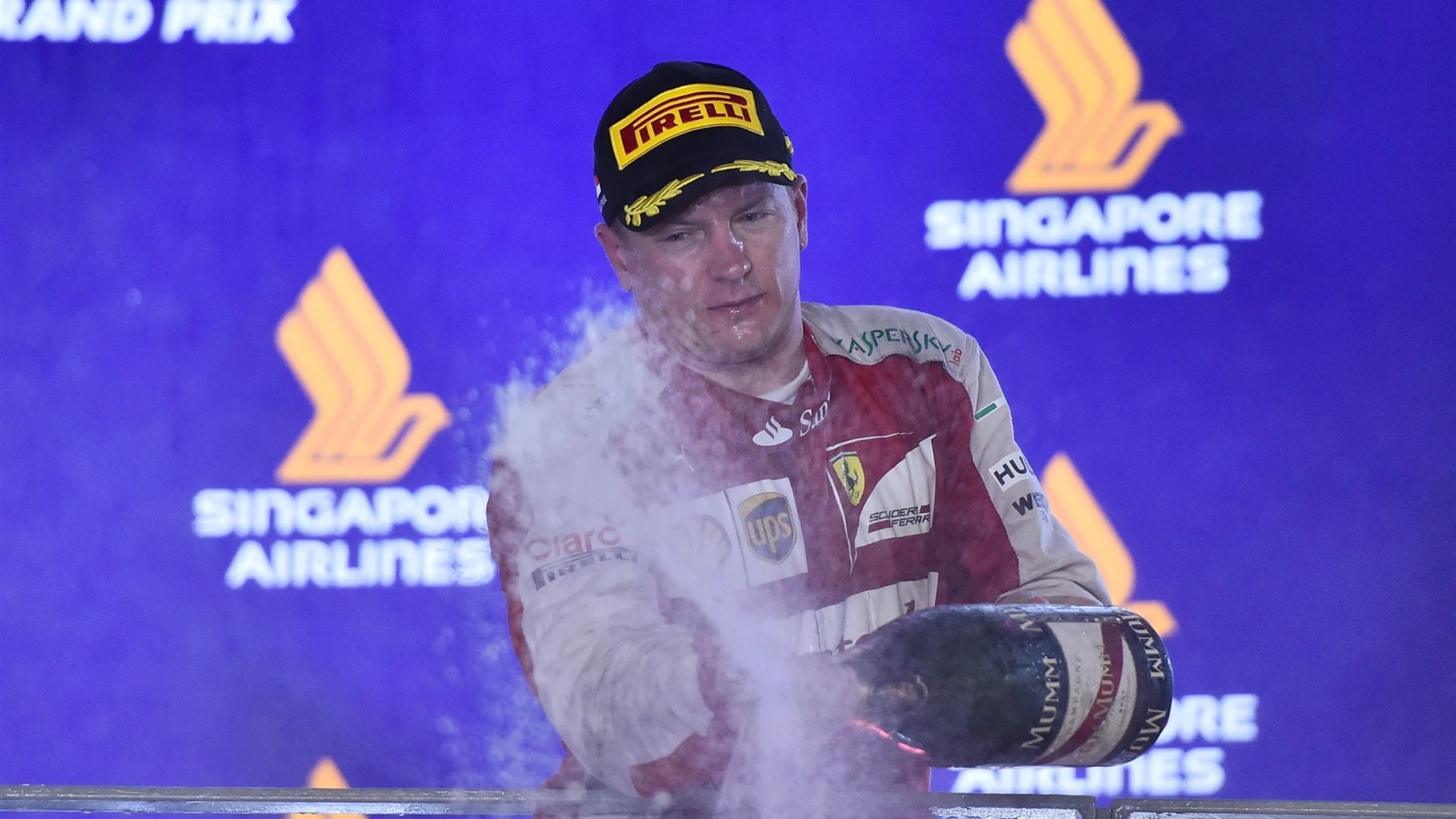 Kimi Raikkonen (FIN) Ferrari celebrates on the podium with the champagne at Formula One World