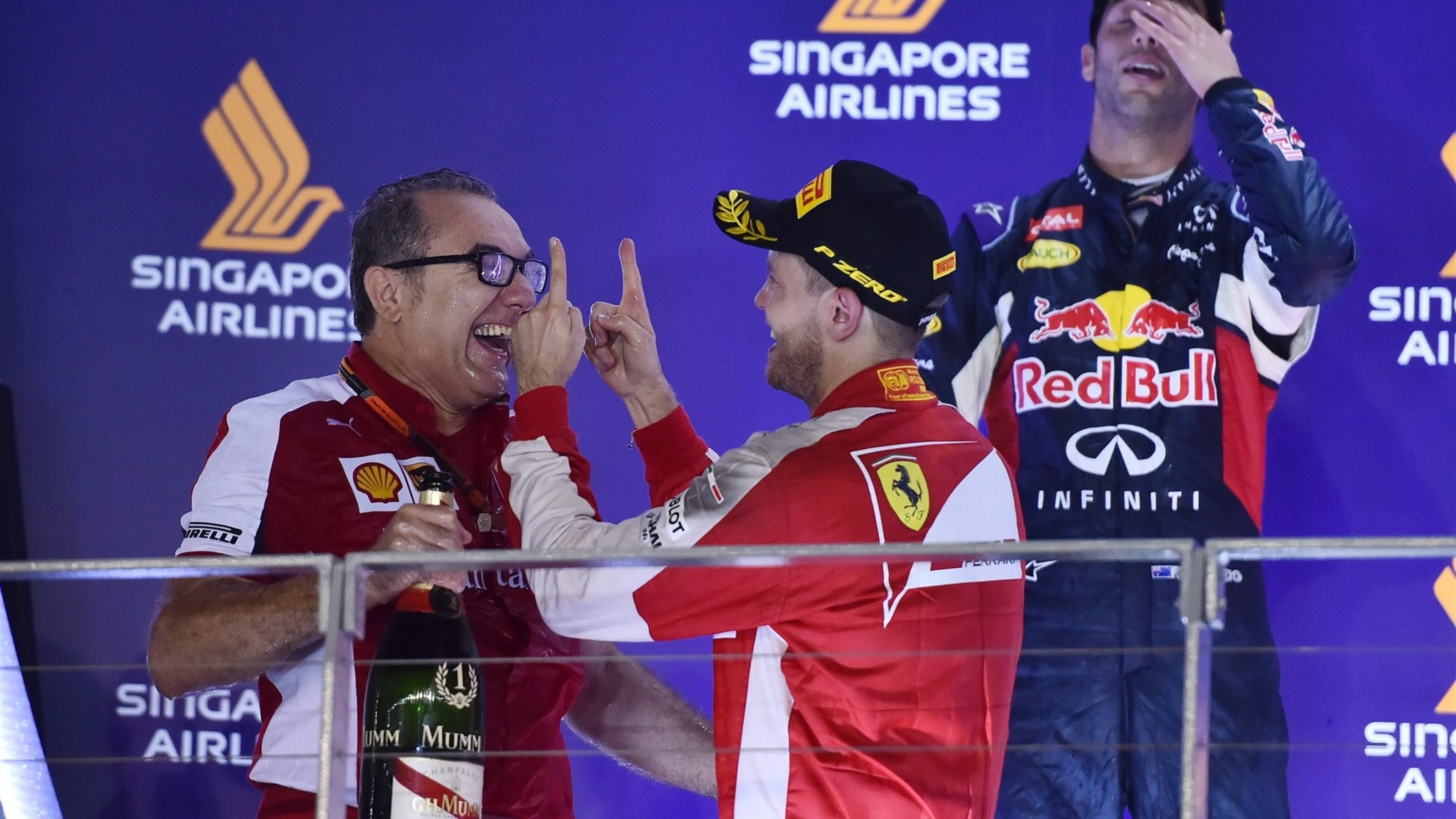 Race winner Sebastian Vettel (GER) Ferrari celebrates on the podium with Modesta Menabue (ITA)