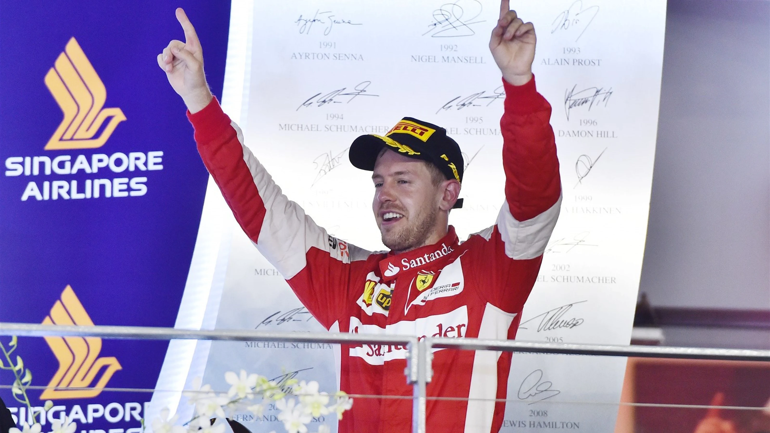 Race winner Sebastian Vettel (GER) Ferrari celebrates on the podium at Formula One World