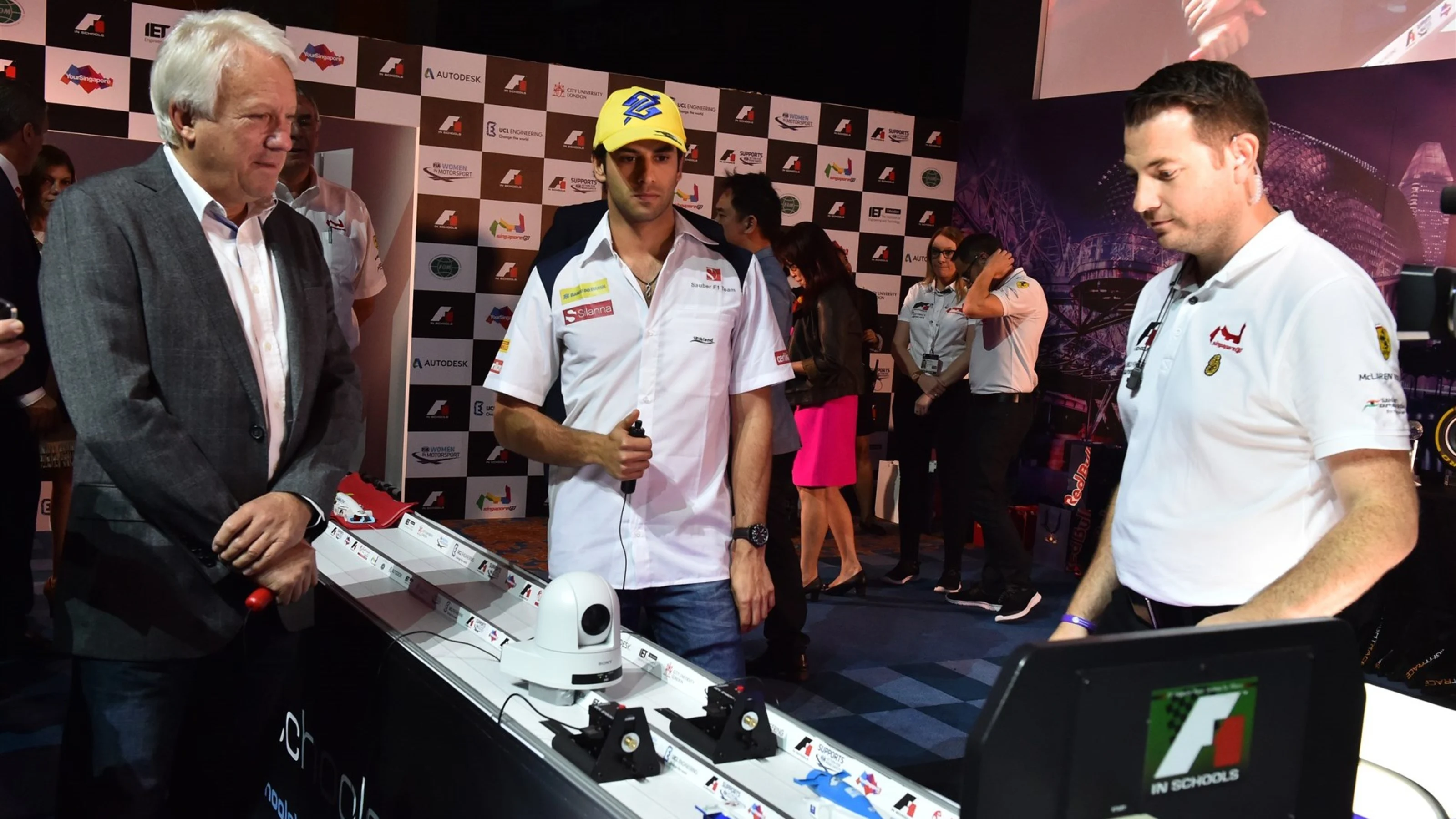 Charlie Whiting (GBR) FIA Delegate and Felipe Nasr (BRA) Sauber at the F1 in Schools Finals at