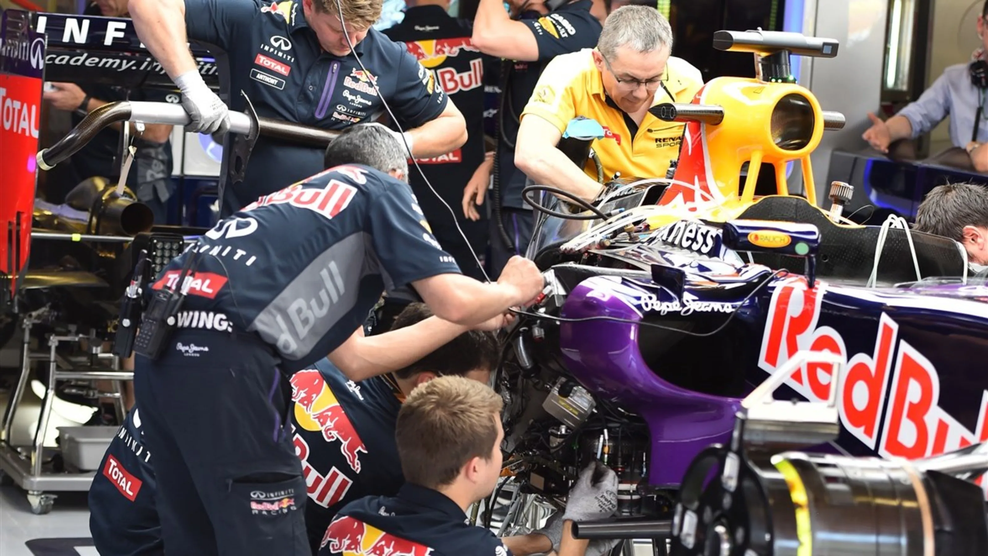 The car of Daniel Ricciardo (AUS) Red Bull Racing RB11 is worked on in the garage at Formula One