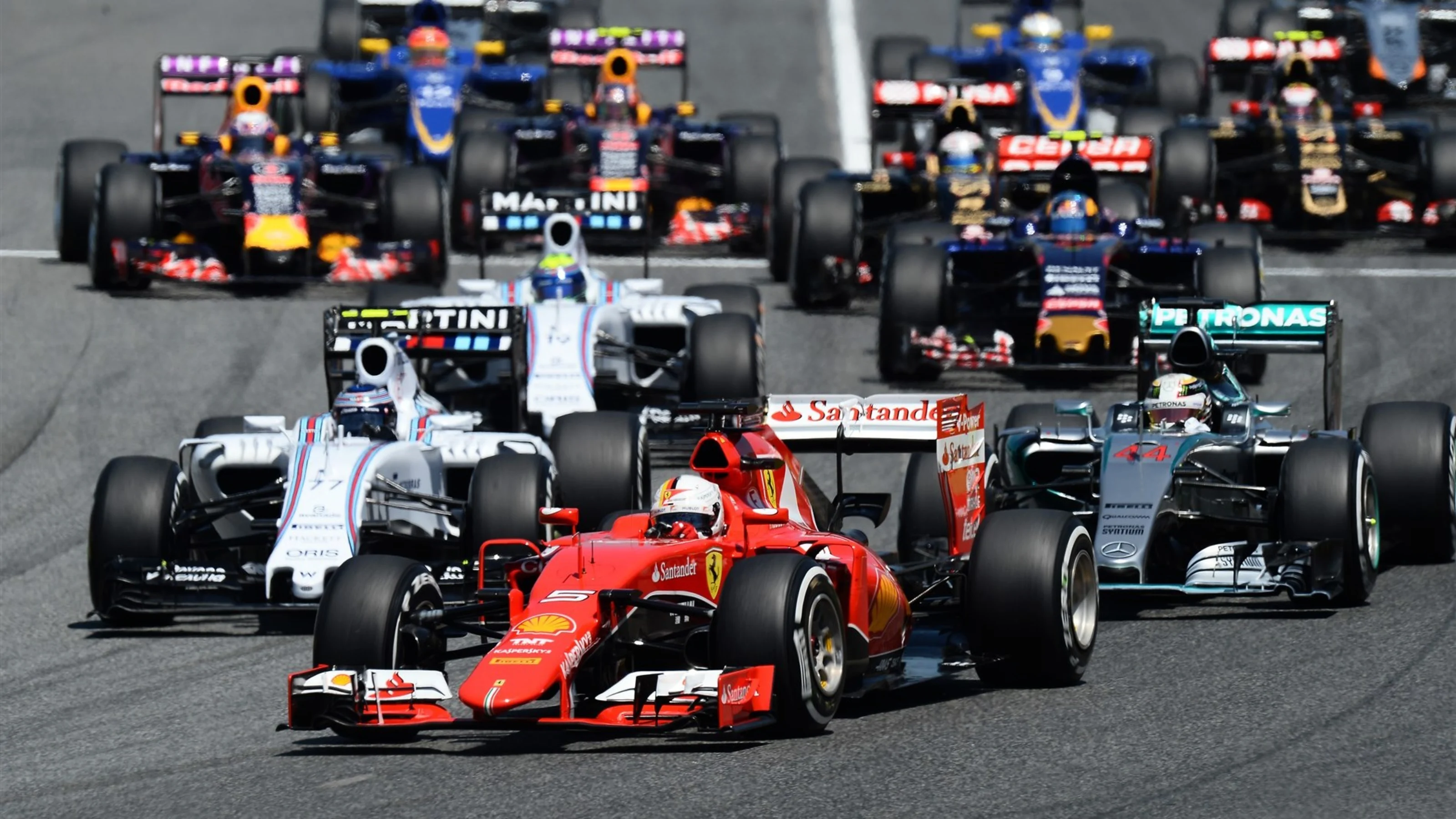 Sebastian Vettel (GER) Ferrari SF15-T and Lewis Hamilton (GBR) Mercedes AMG F1 W06 battle at the