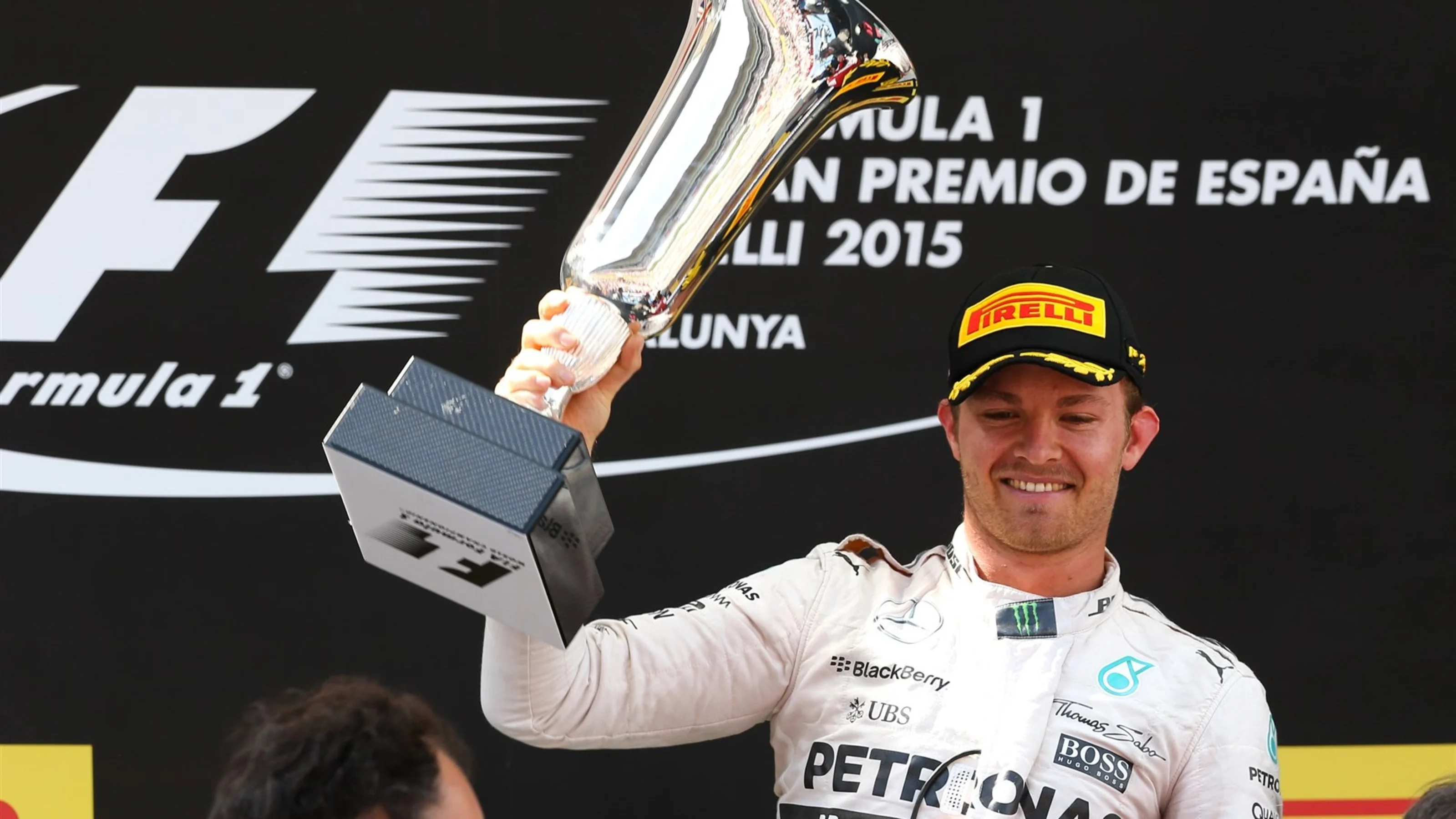 Race winner Nico Rosberg (GER) Mercedes AMG F1 celebrates with his trophy on the podium at Formula