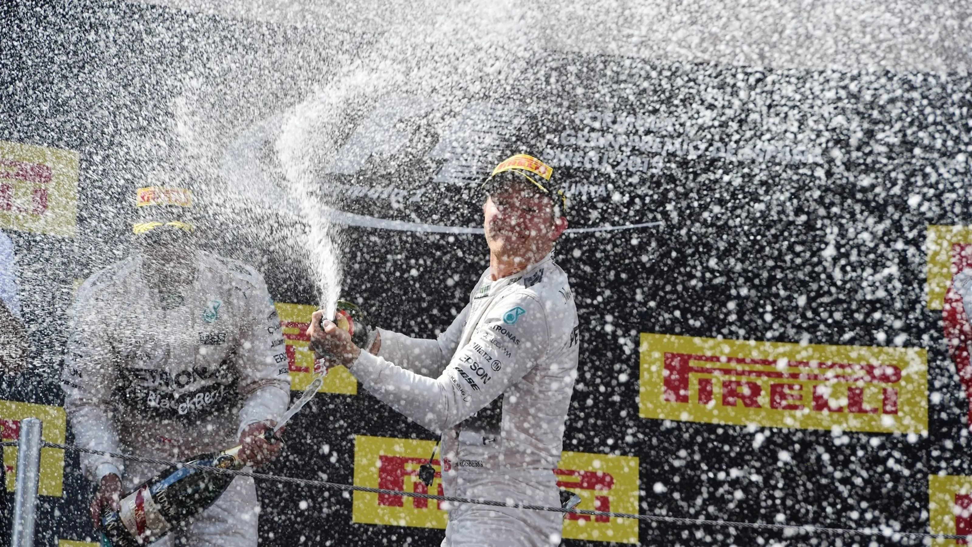 Race winner Nico Rosberg (GER) Mercedes AMG F1 celebrates on the podium with the champagne at