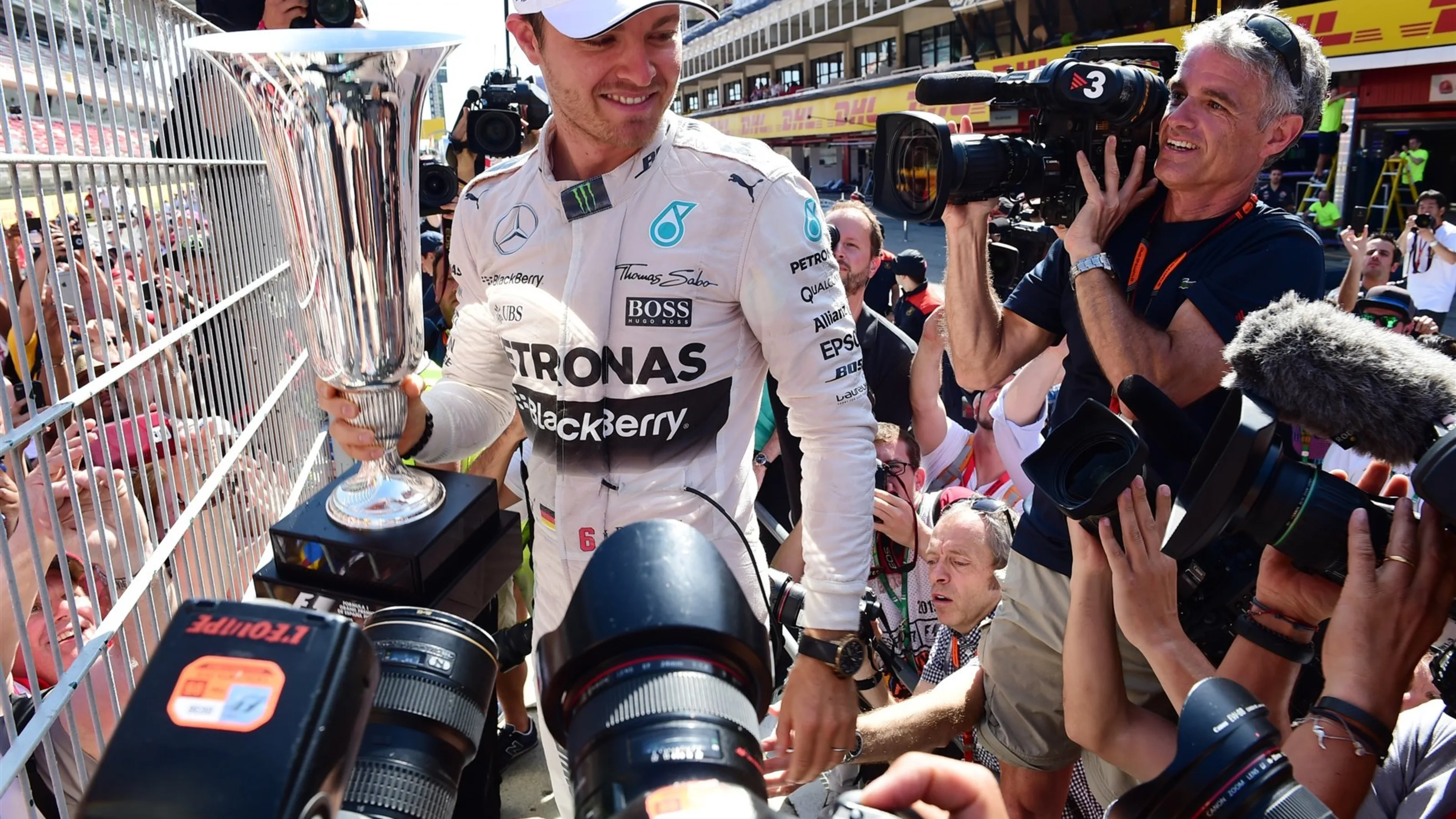 Race winner Nico Rosberg (GER) Mercedes AMG F1 celebrates with the trophy at Formula One World