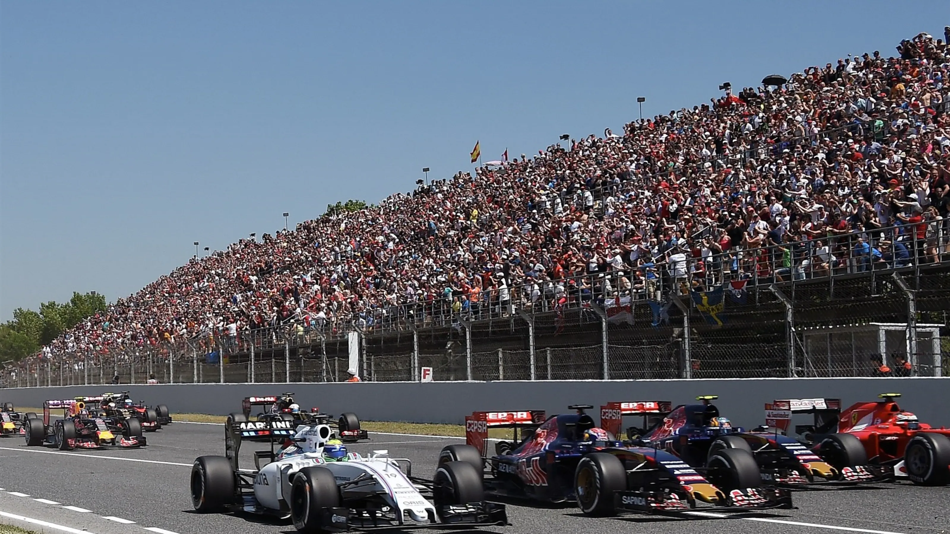 Felipe Massa (BRA) Williams FW37 and Max Verstappen (NDL) Scuderia Toro Rosso STR10 at the start of