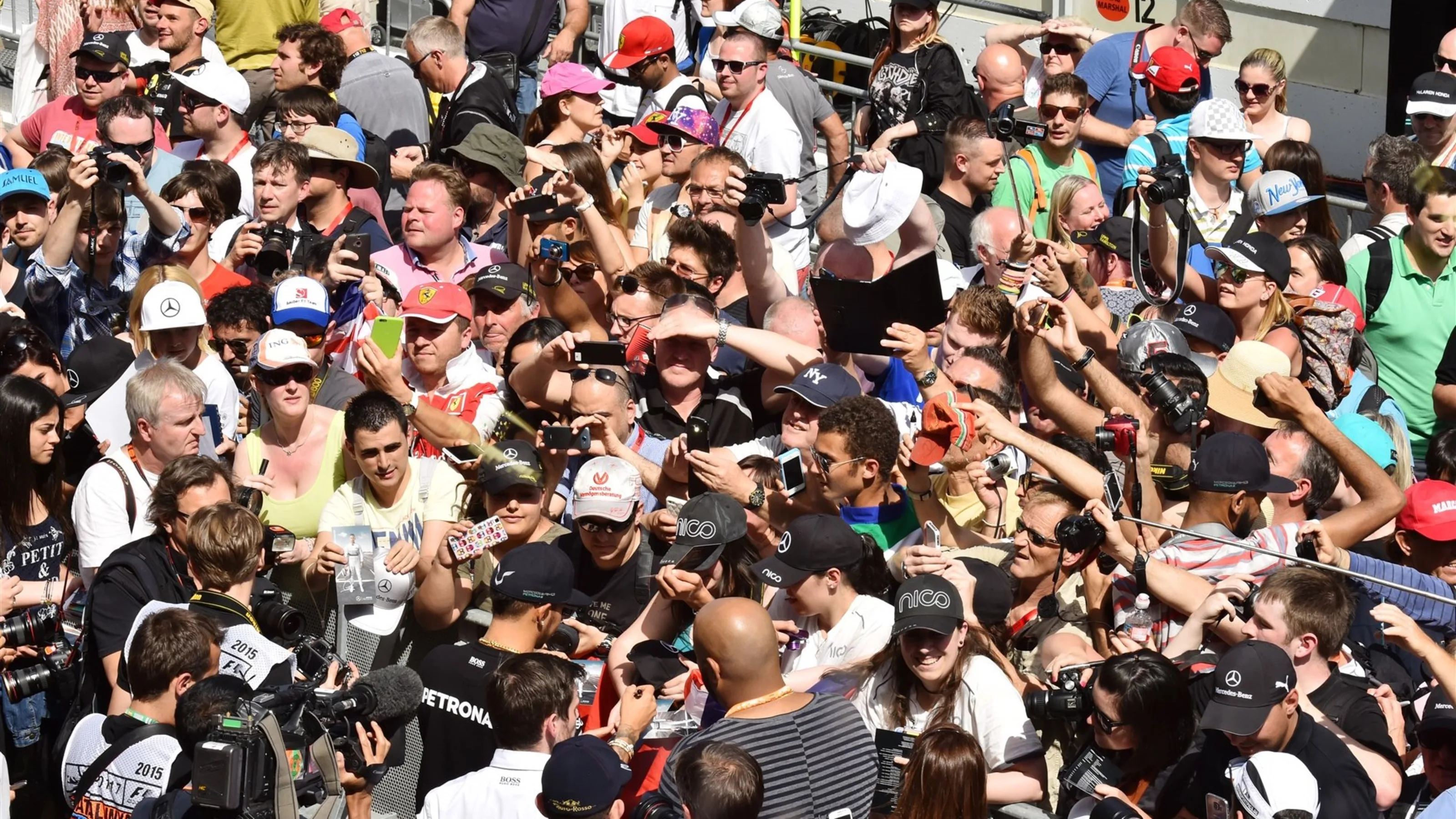 Lewis Hamilton (GBR) Mercedes AMG F1 signs autographs for the fans at Formula One World
