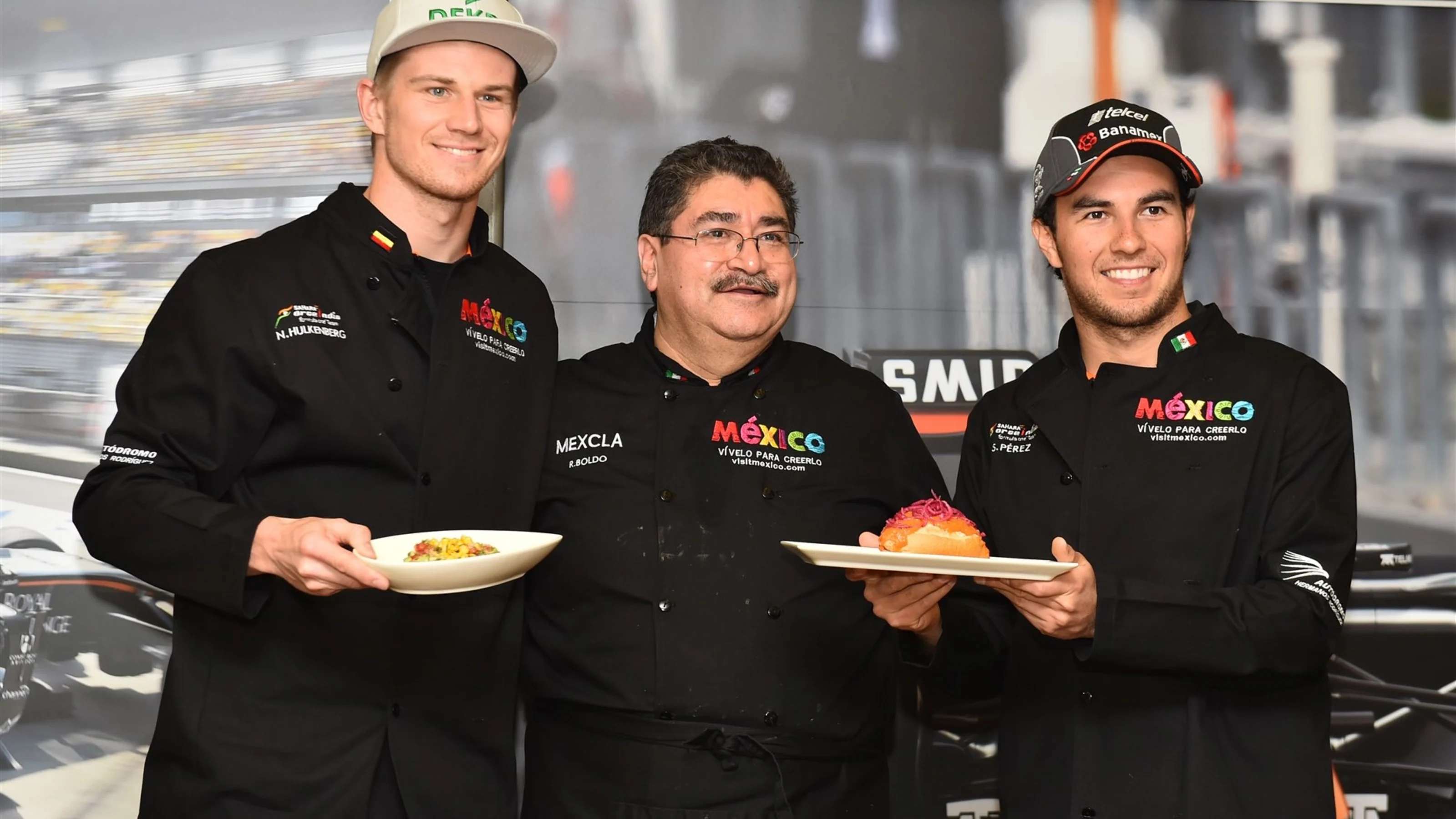 Sergio Perez (MEX) Force India and Nico Hulkenberg (GER) Force India F1 at The Taste of Mexico in