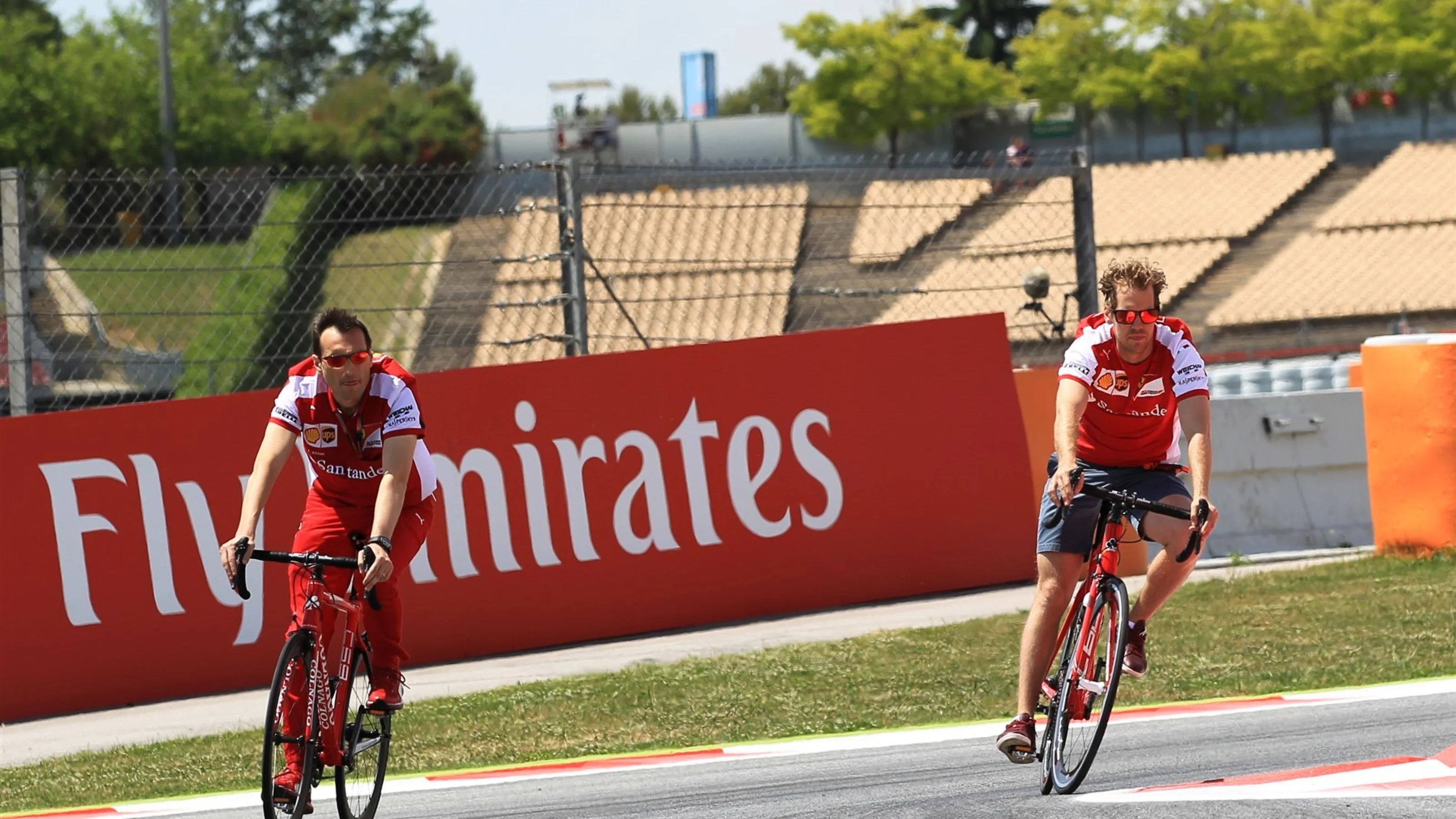 Sebastian Vettel (GER) Ferrari rides a bike on the track at Formula One World Championship, Rd5,