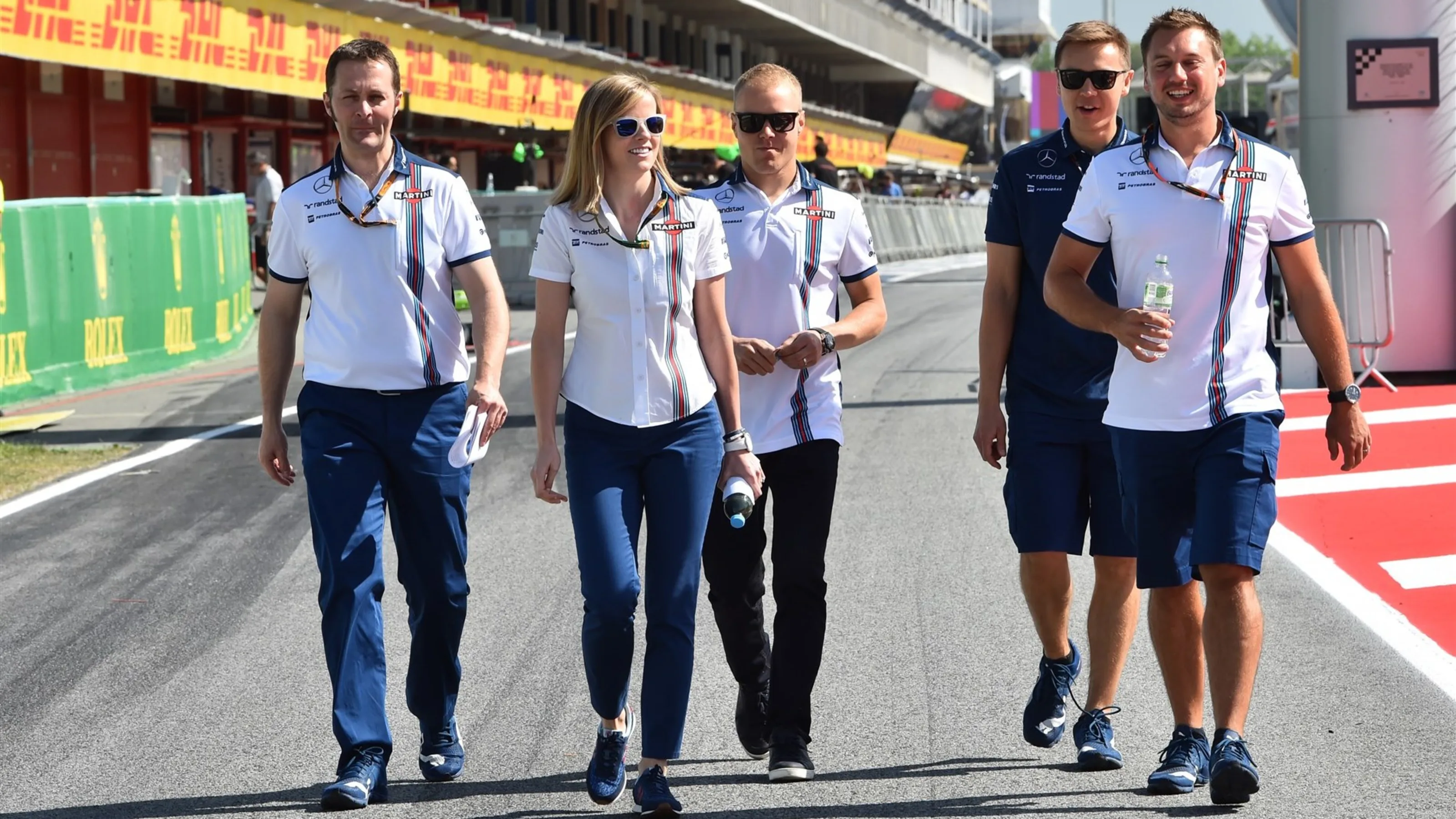 Susie Wolff (GBR) Williams Development Driver and Valtteri Bottas (FIN) Williams walk the circuit