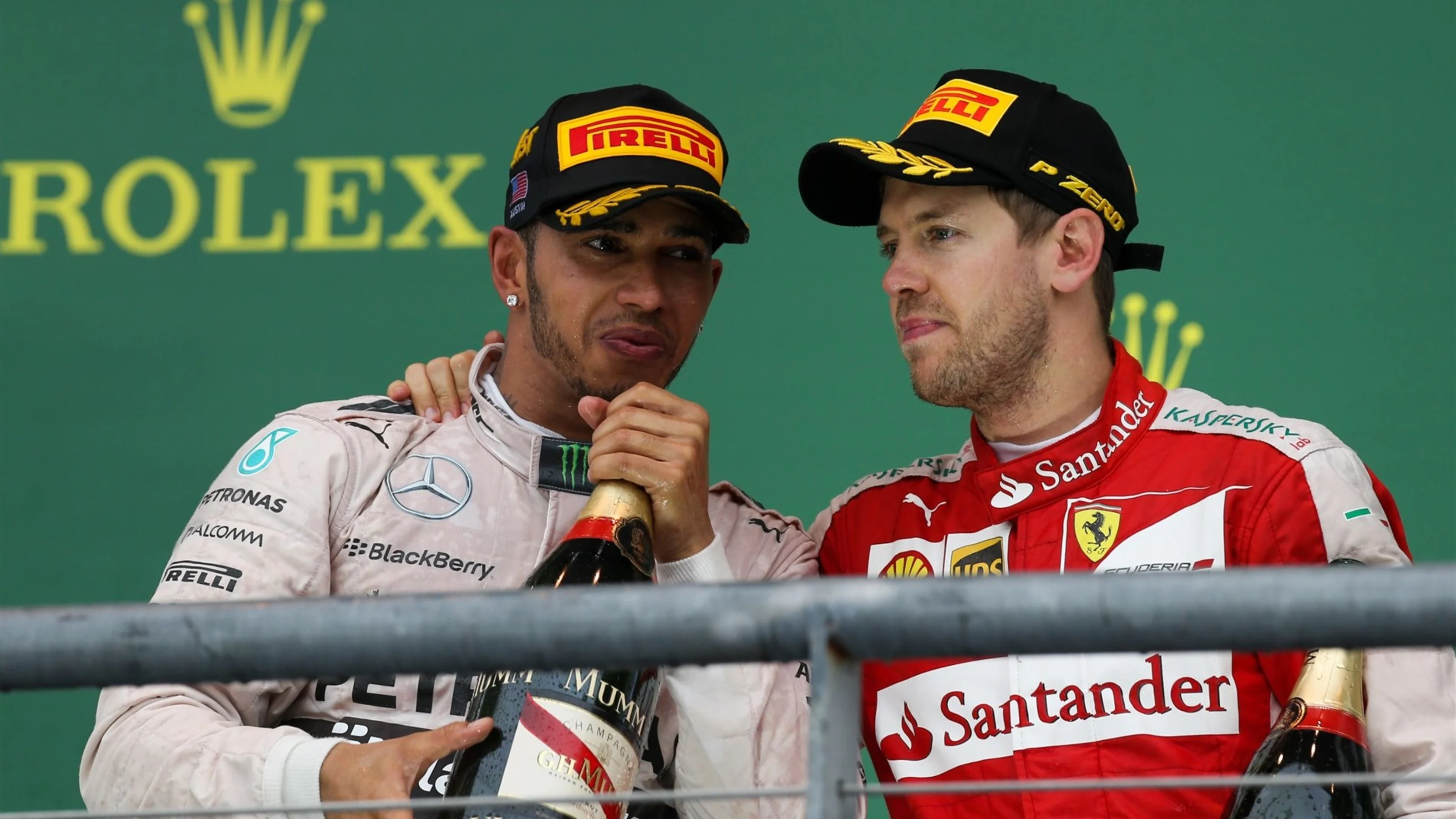Sebastian Vettel (GER) Ferrari and race winner Lewis Hamilton (GBR) Mercedes AMG F1 celebrate on