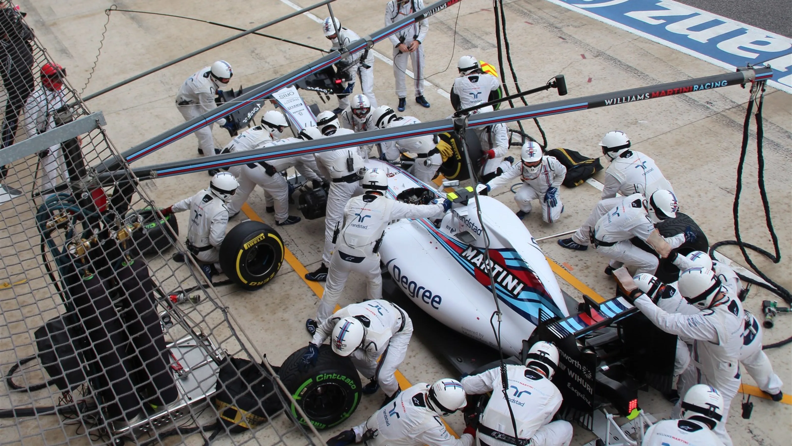 Valtteri Bottas (FIN) Williams FW37 pit stop with broken front wing at Formula One World