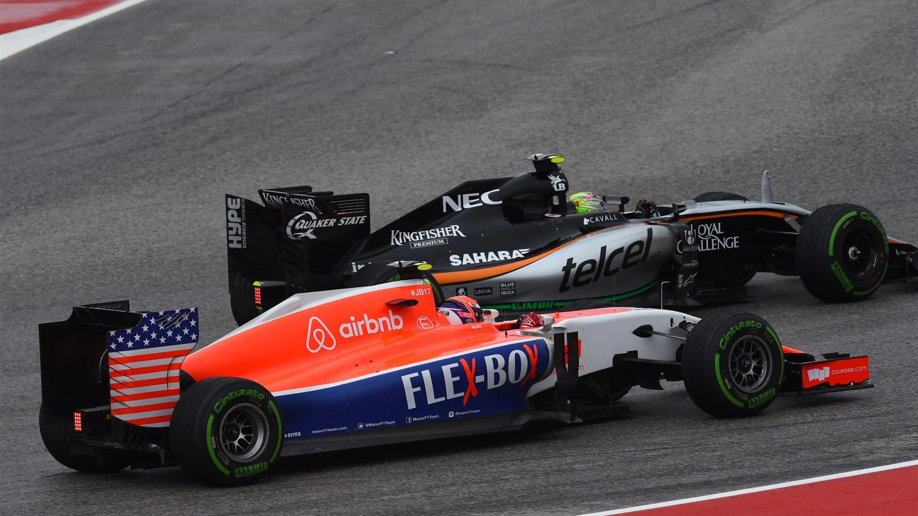 Alexander Rossi (USA) Manor GP and Sergio Perez (MEX) Force India VJM08 battle at Formula One World