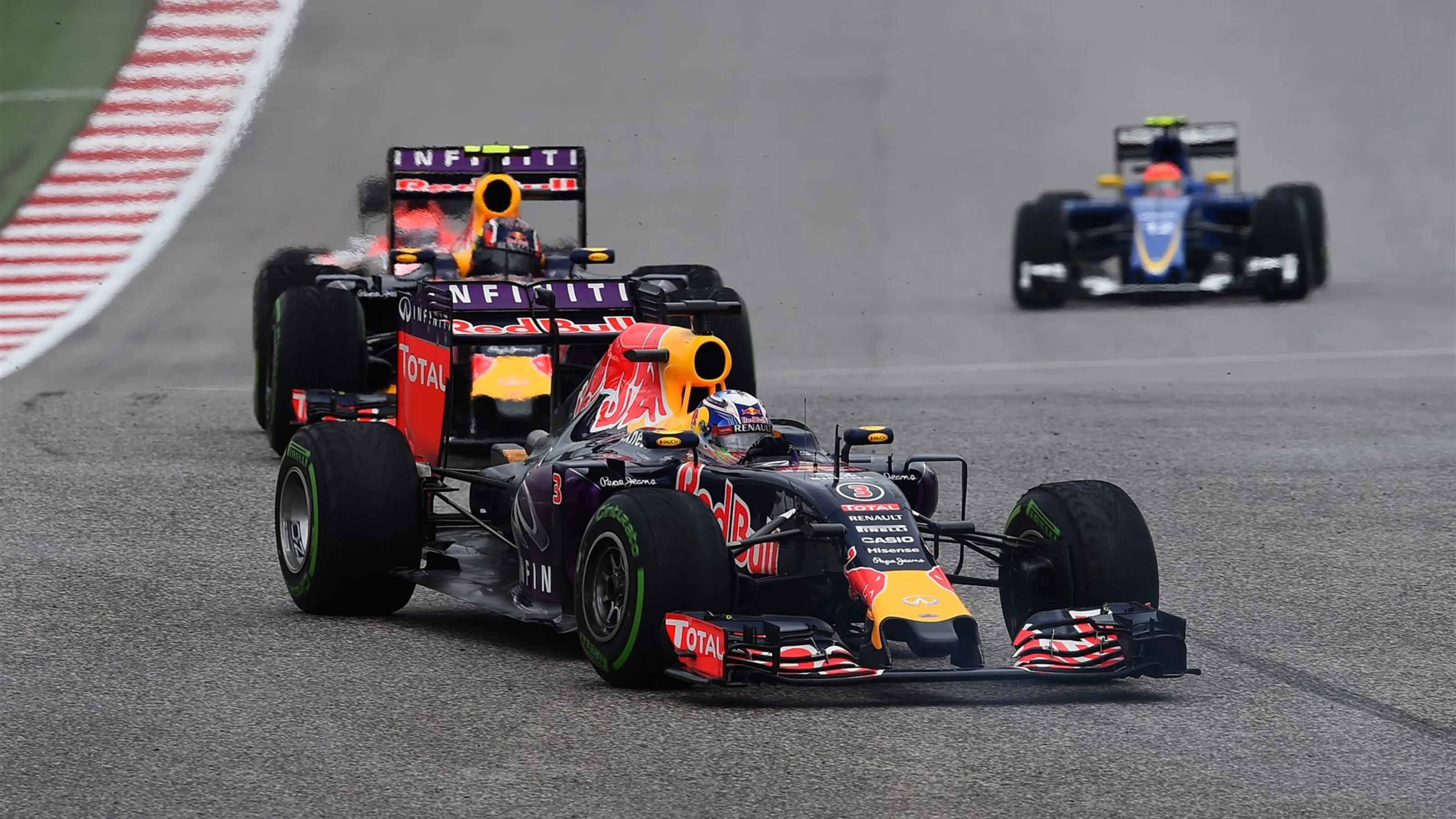 Daniel Ricciardo (AUS) Red Bull Racing RB11 leads Daniil Kvyat (RUS) Red Bull Racing RB11 at