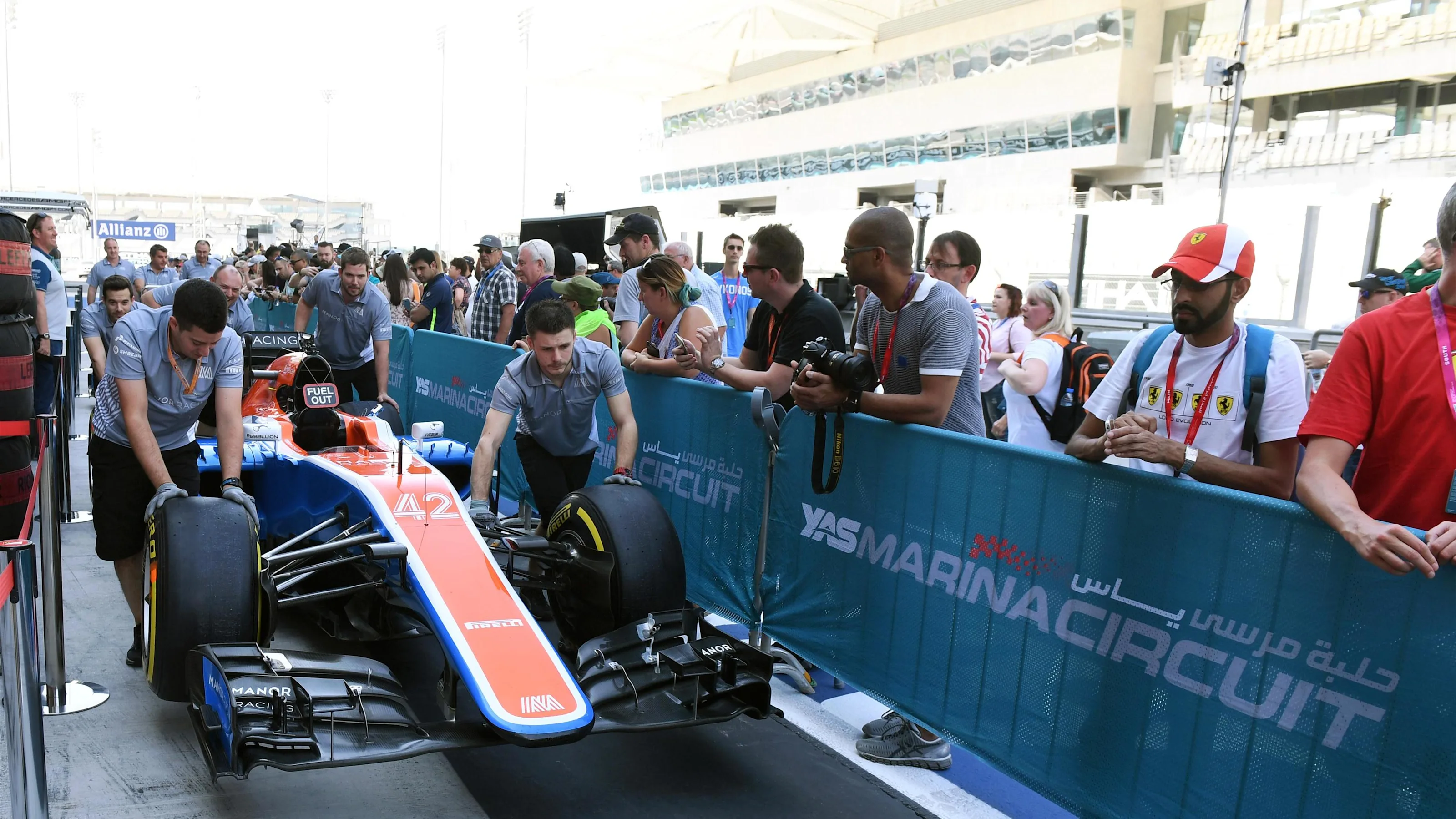 Manor Racing mechanics and Manor Racing MRT05 in pit lane at Formula One World Championship, Rd21,