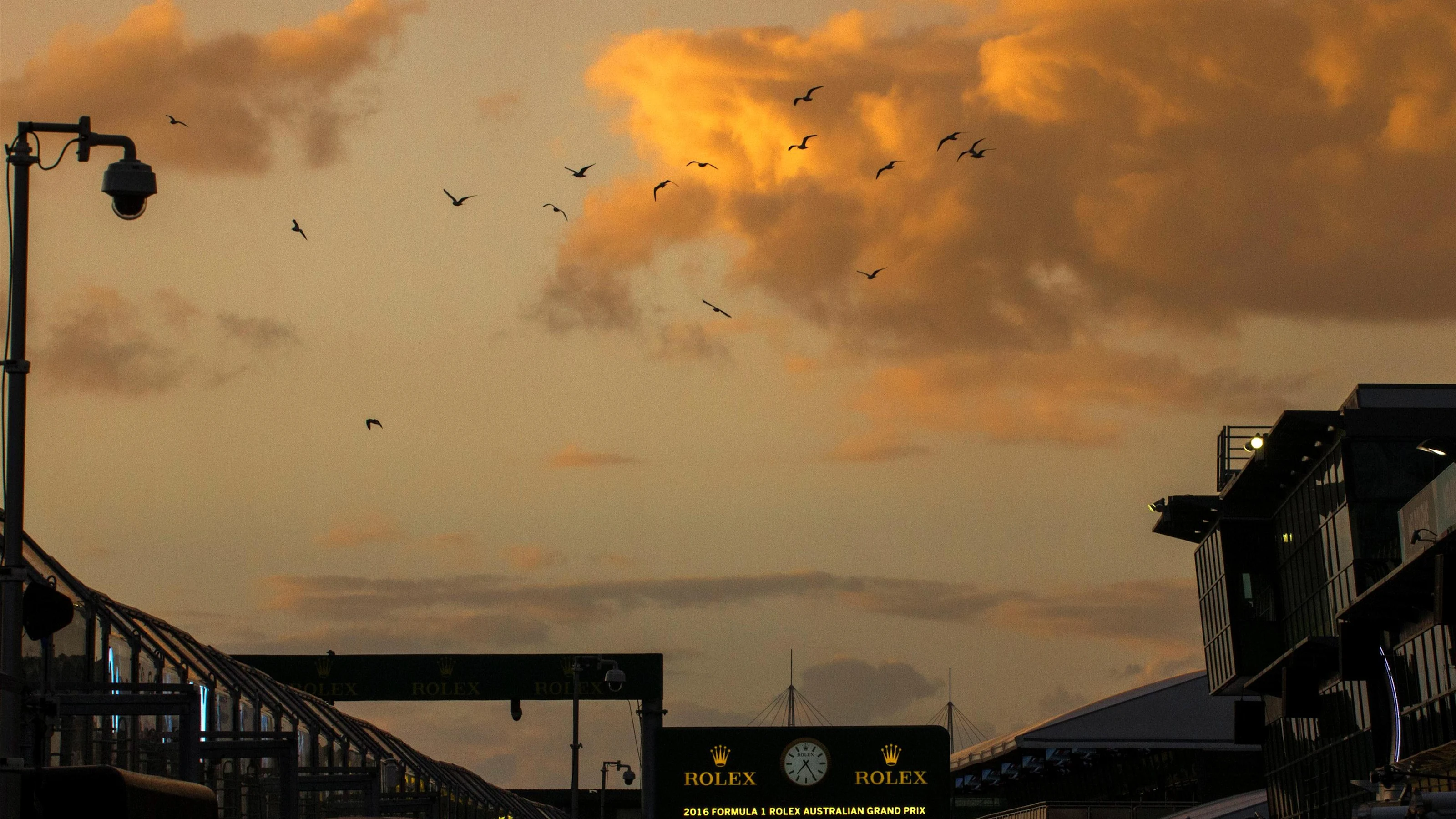 Sunrise and birds over pit lane at Formula One World Championship, Rd1, Australian Grand Prix,